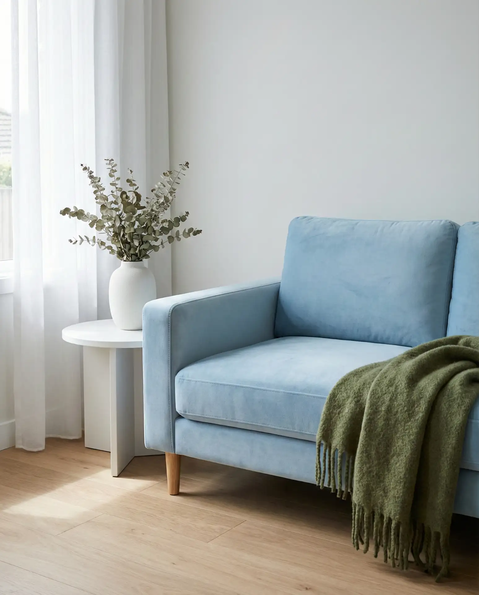 Baby Blue Sofa with Moss Green Throw Blankets 2