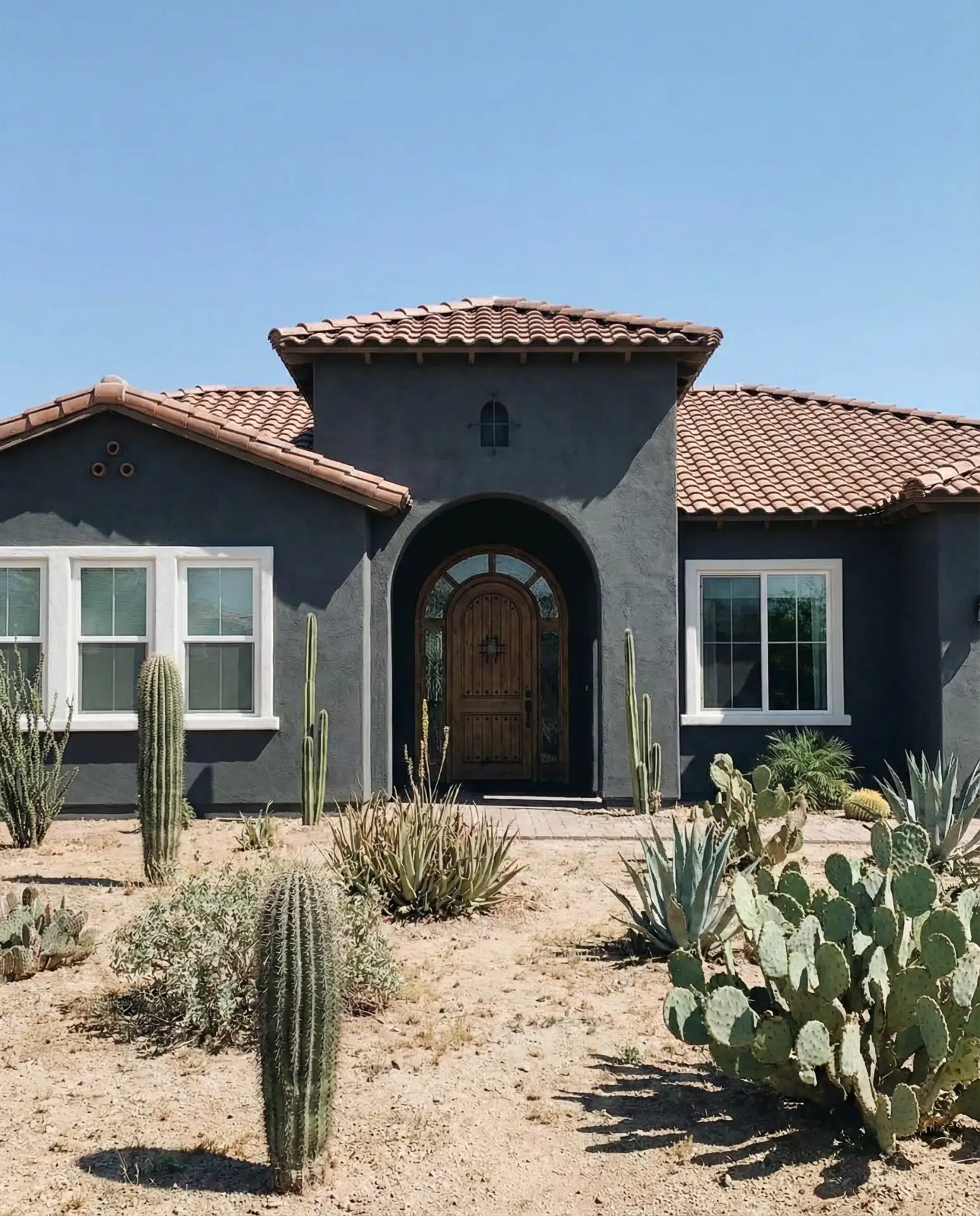 Charcoal Stucco with White Trim and Terracotta Roof 1