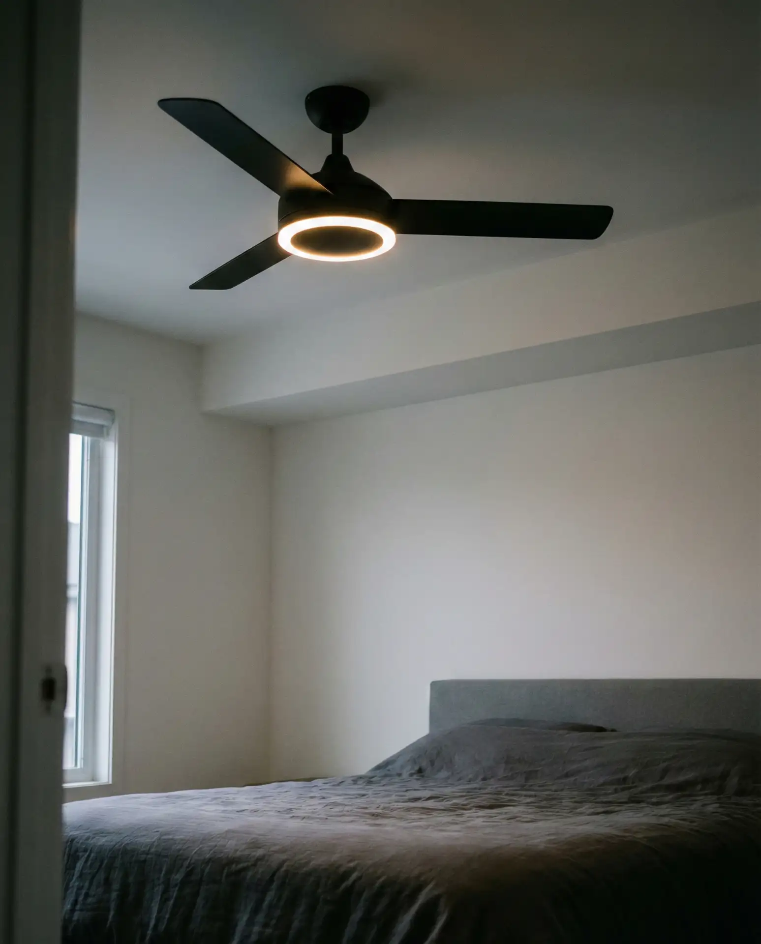 Green Velvet Headboard with Brass Wall Sconces 2