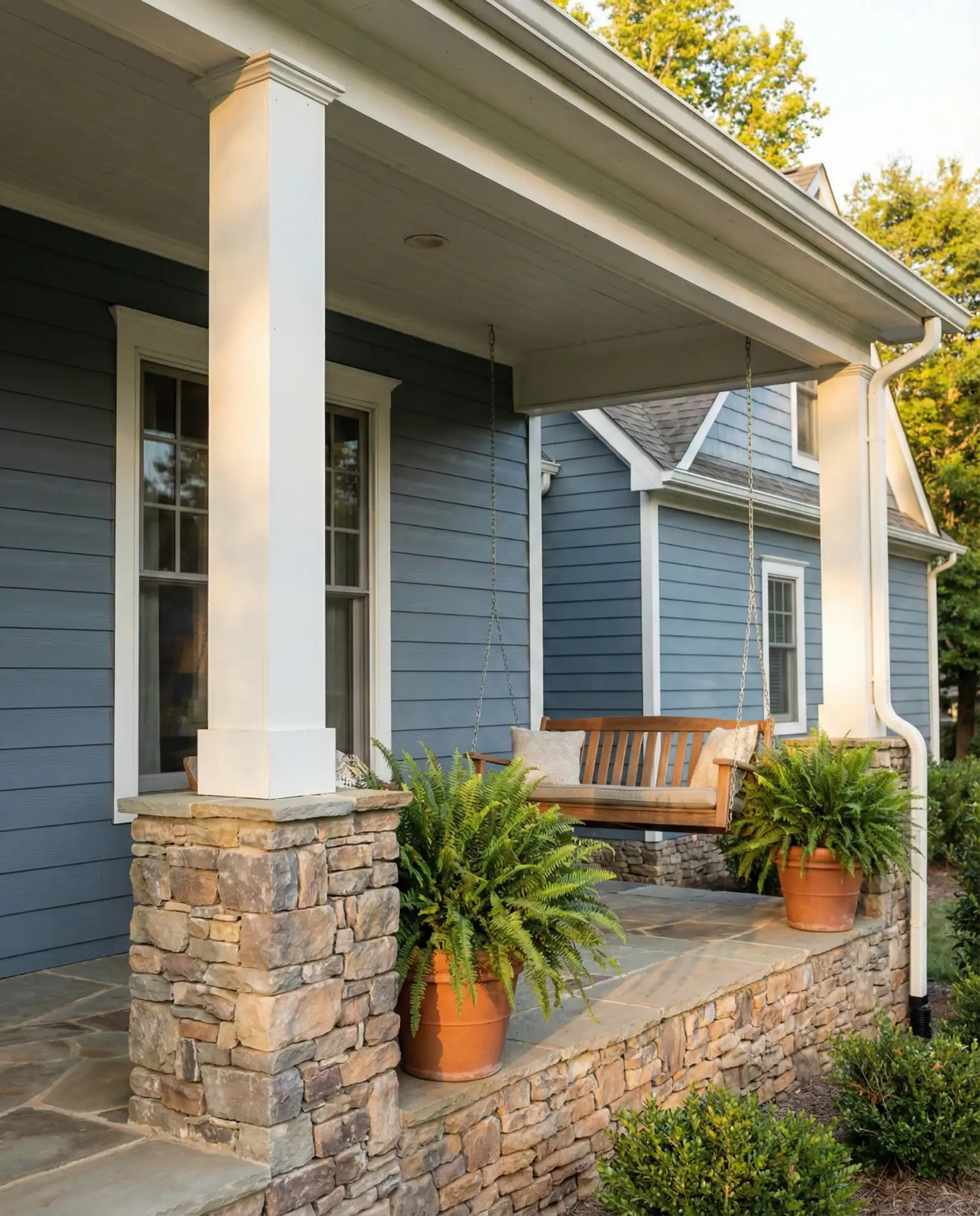 Slate Blue Farmhouse with Natural Stone and White Trim 2