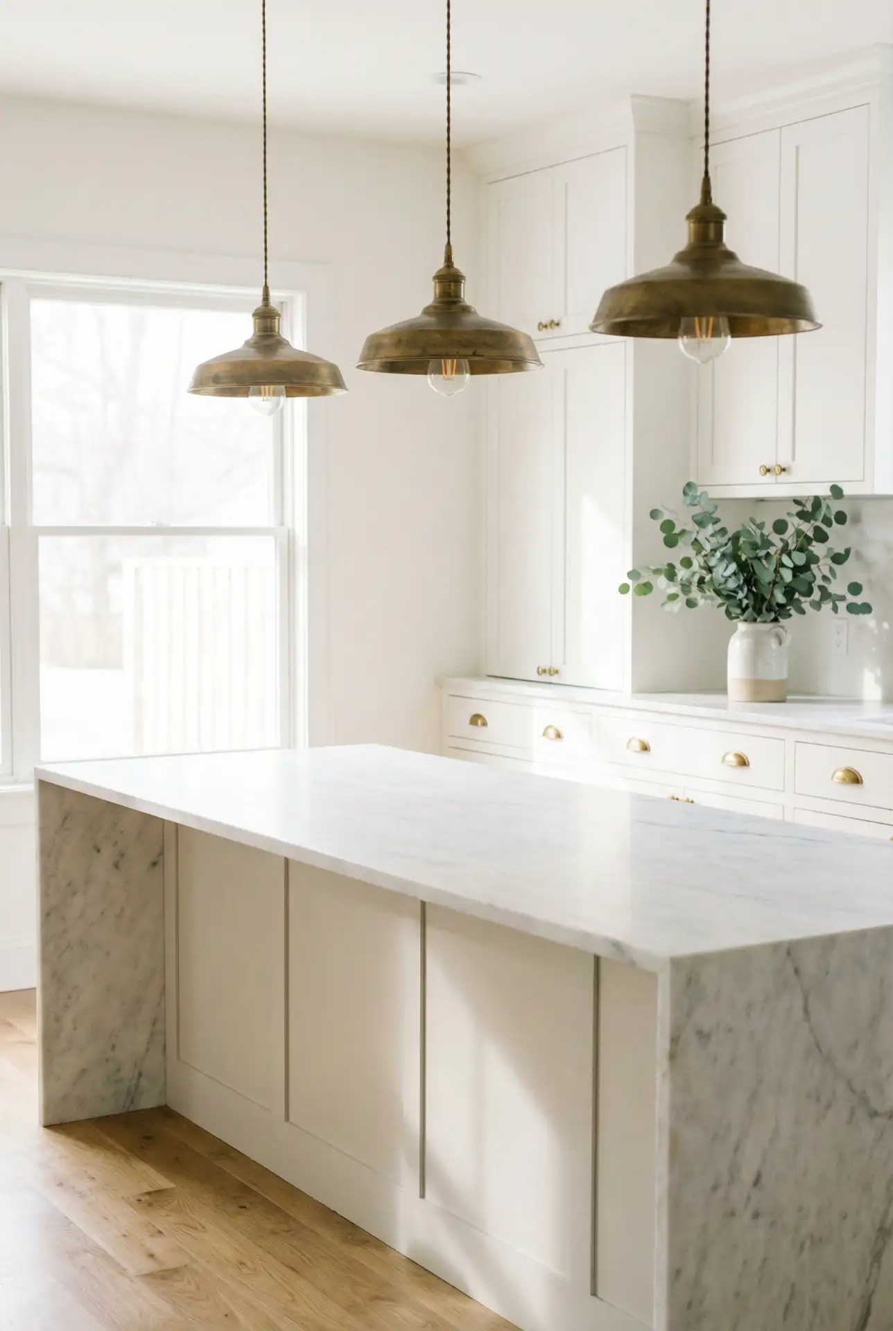 Sleek Brass Pendant Fixtures Over Island 1