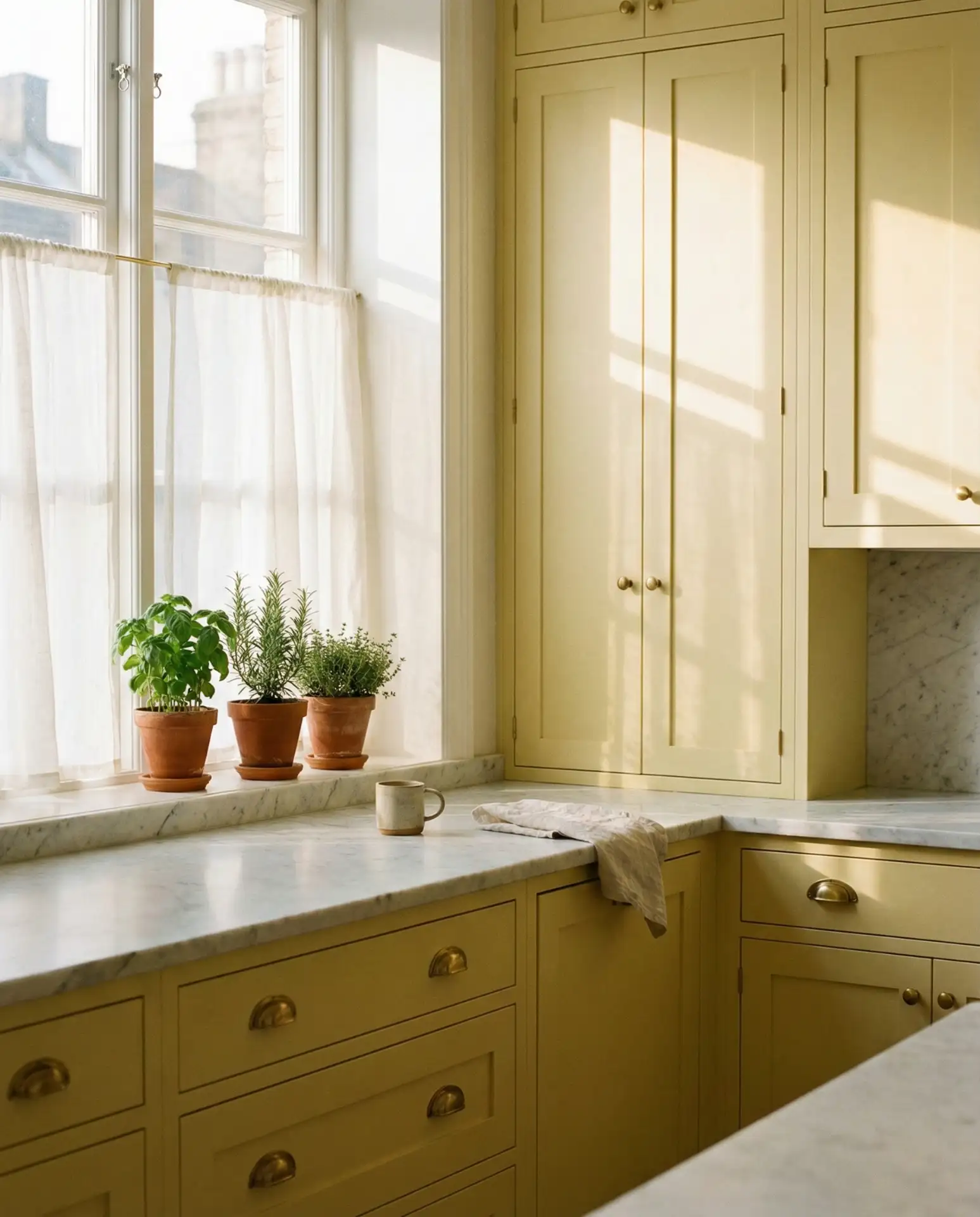 Soft Butter Cabinets with Marble Countertops 1