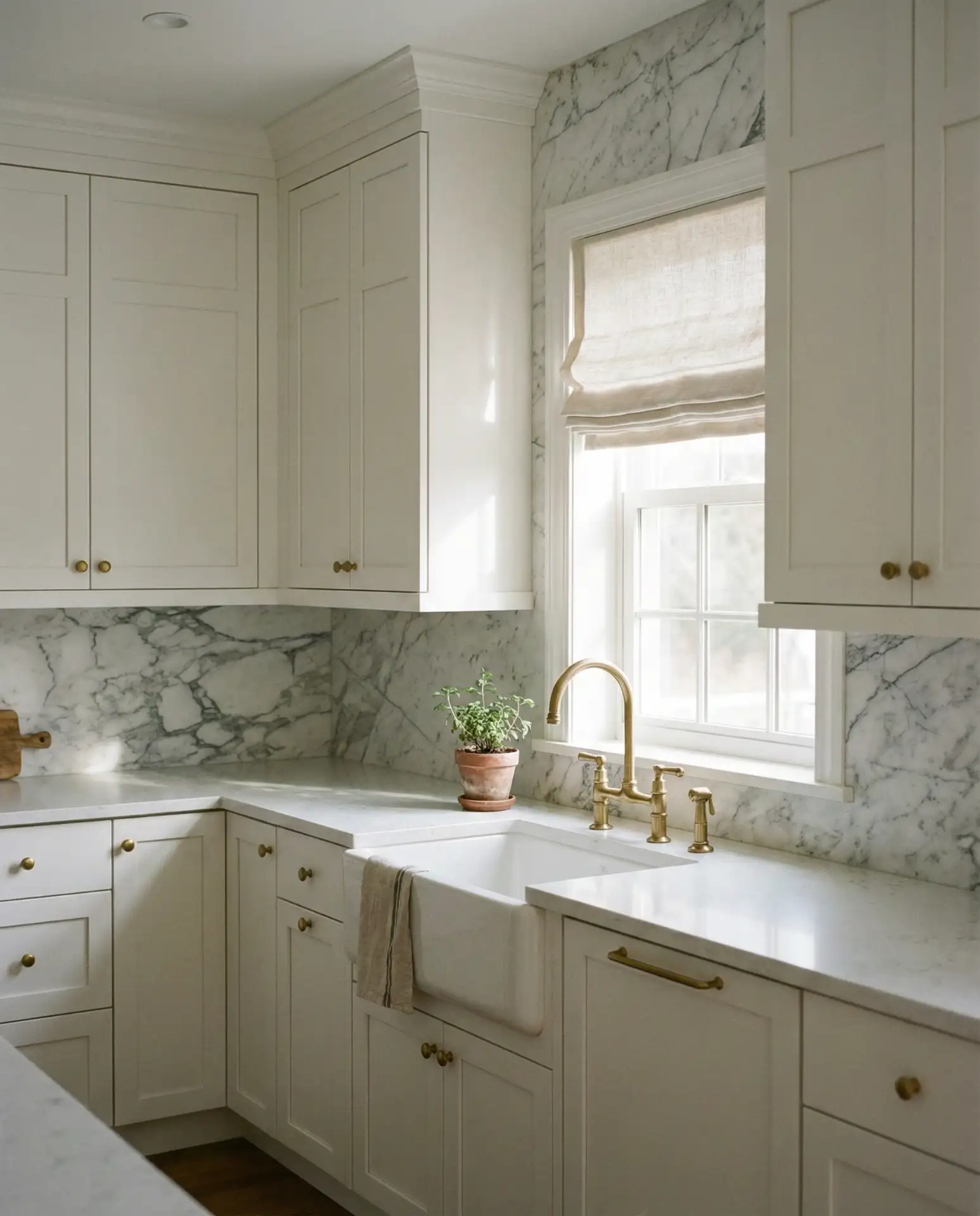 White Shaker Cabinets with Marble Backsplash 1
