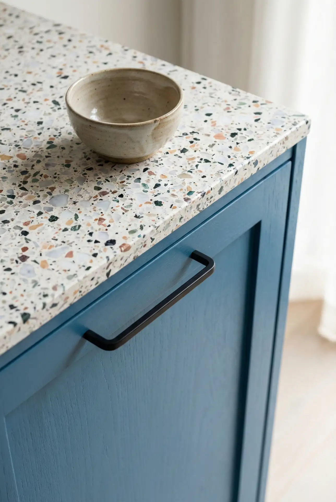 Blue Kitchen with Terrazzo Countertops and Matte Black Fixtures 1