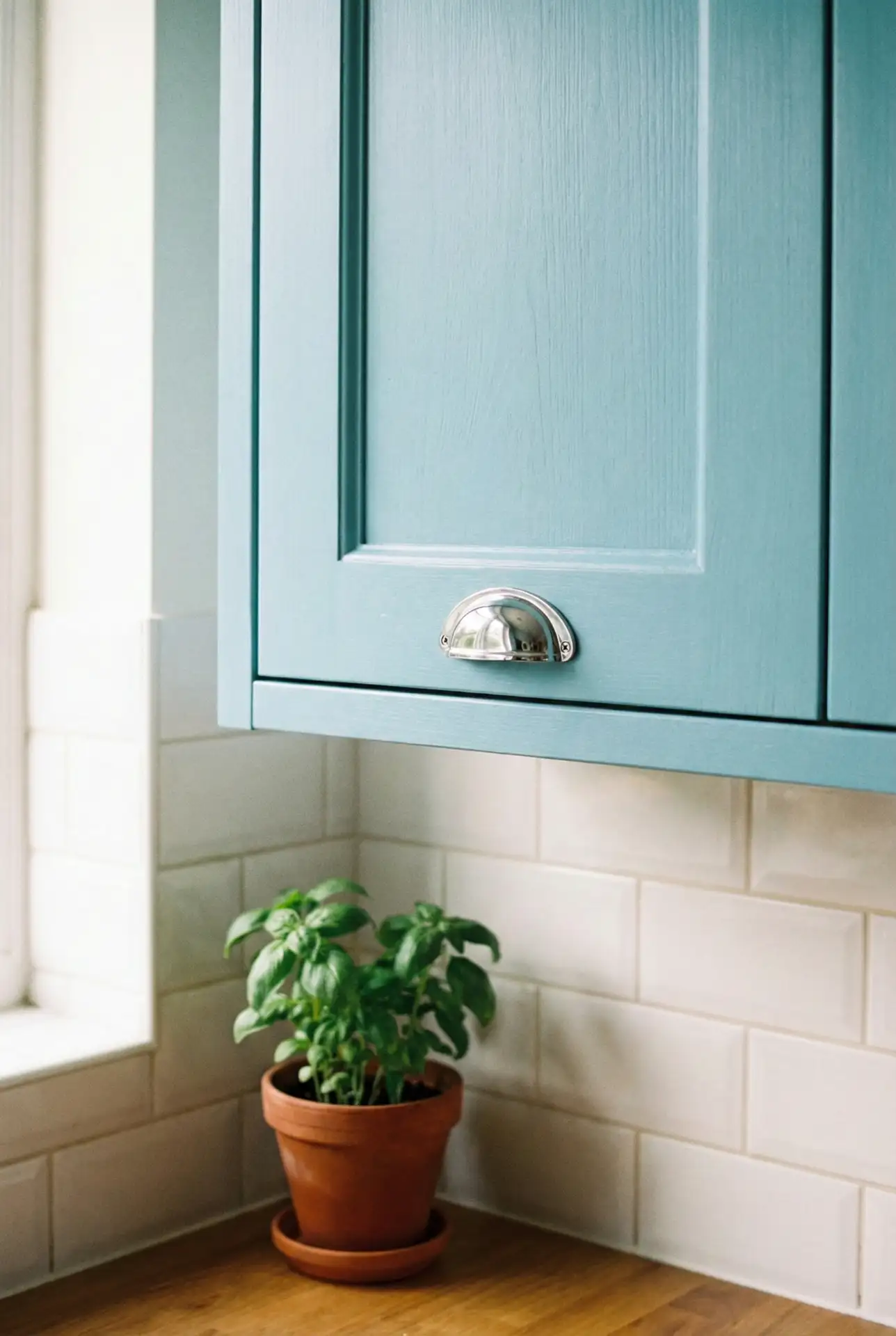Blue Kitchen with Terrazzo Countertops and Matte Black Fixtures 2