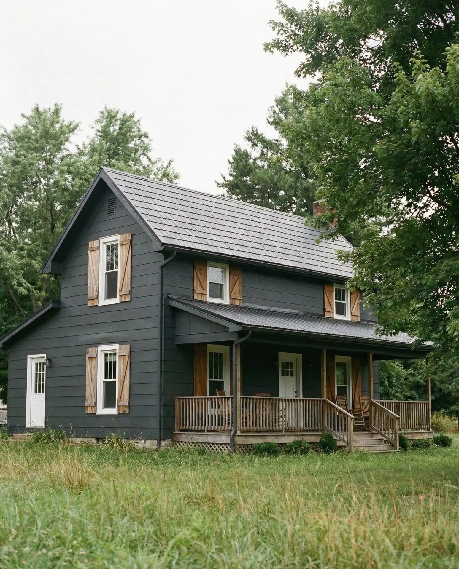 Dark Charcoal Siding with Warm Wood Shutters 2
