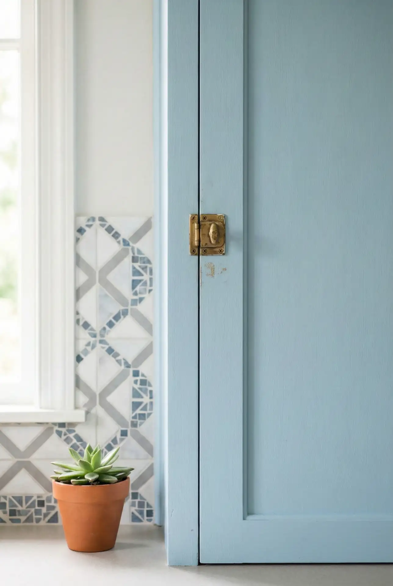 Pastel Blue Cabinets with Patterned Tile Backsplash 2