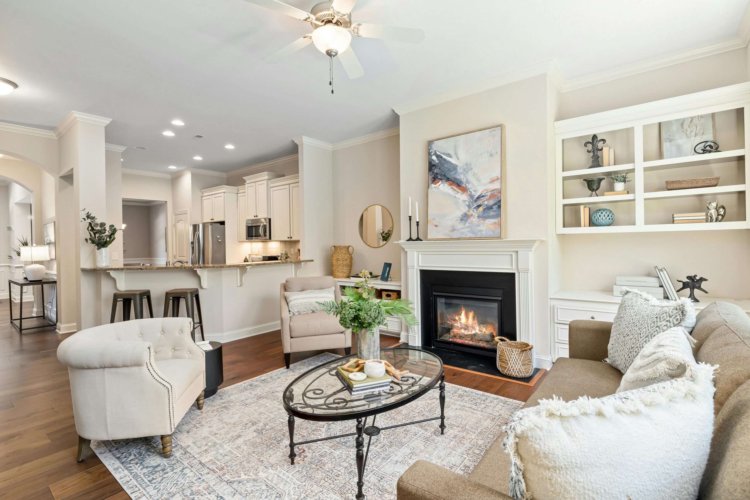 A cozy and elegant modern living room featuring a fireplace and stylish decor.