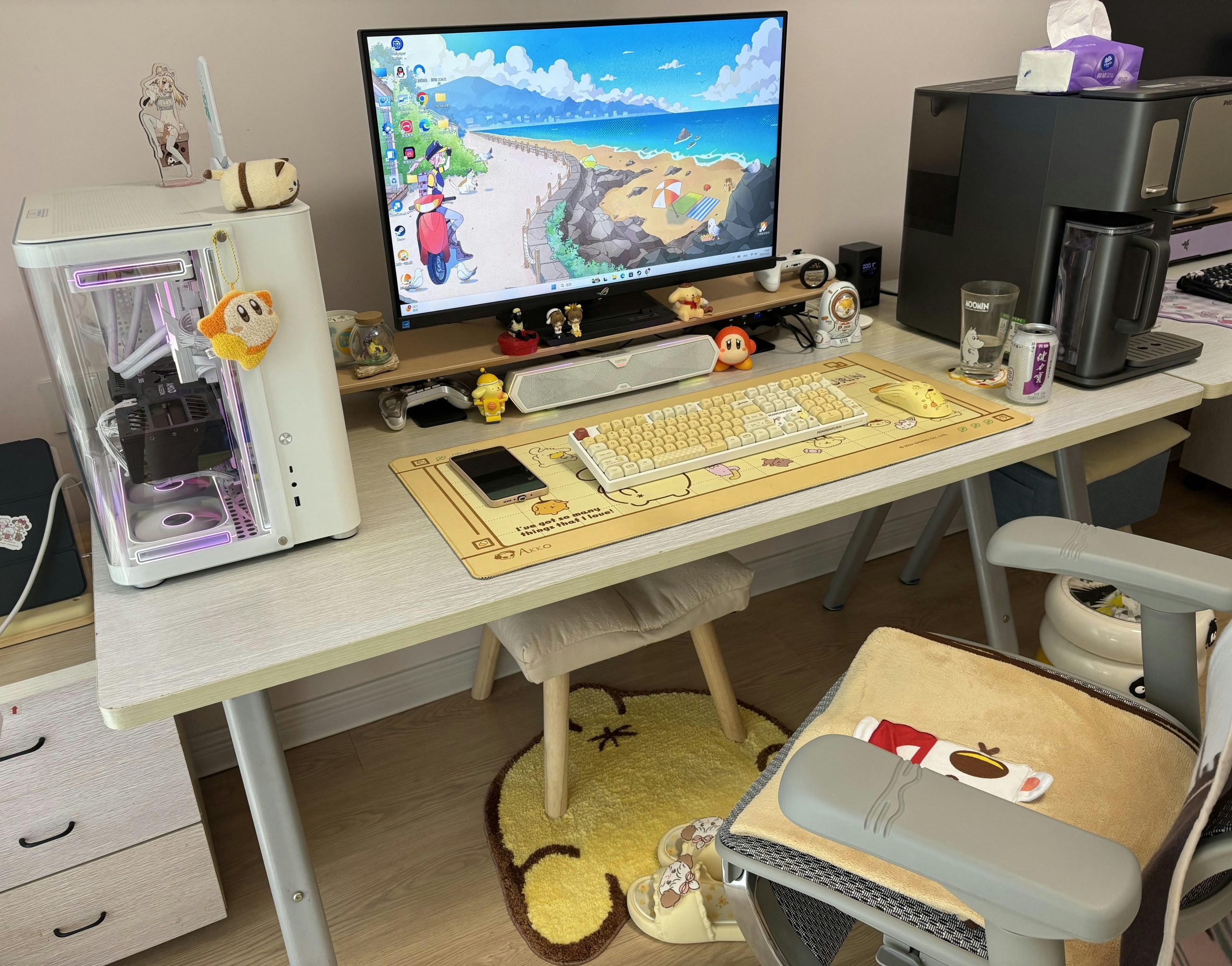 A trendy gaming setup with a desktop PC, monitor, and cute decorations in a cozy room.