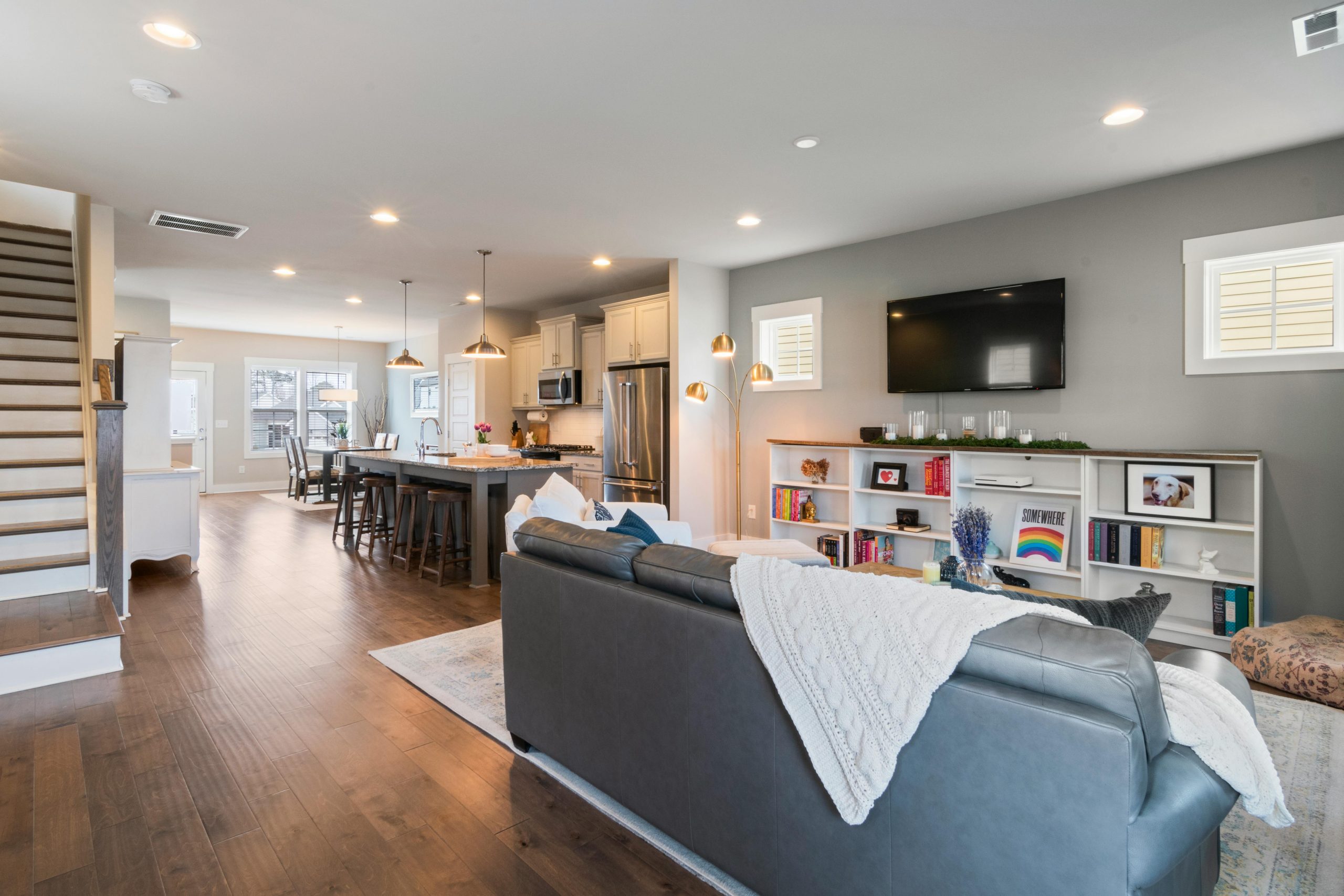 Bright and airy living space with open kitchen and modern decor creating a welcoming ambiance.