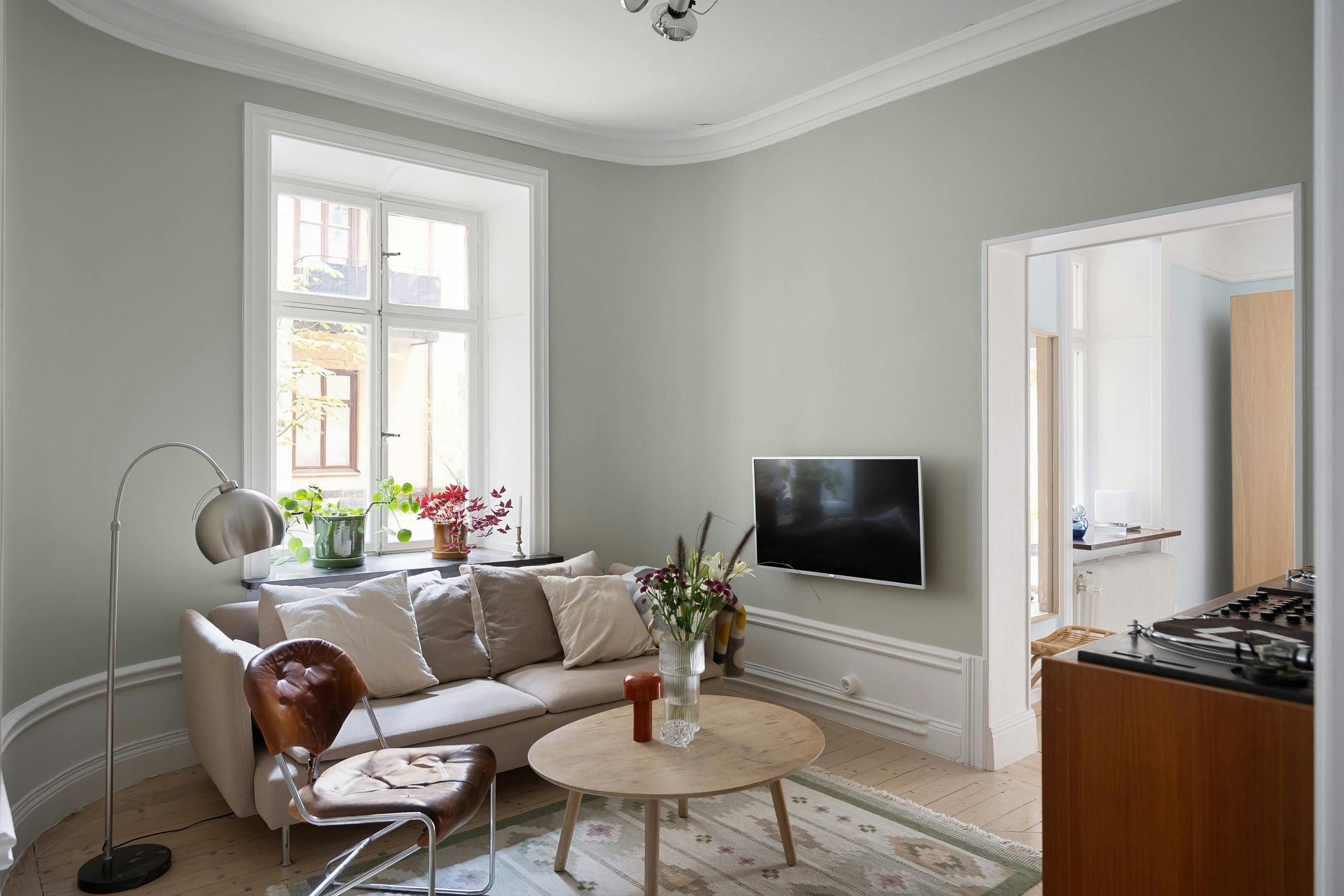 Bright and stylish living room featuring modern furniture and elegant decor with natural light.