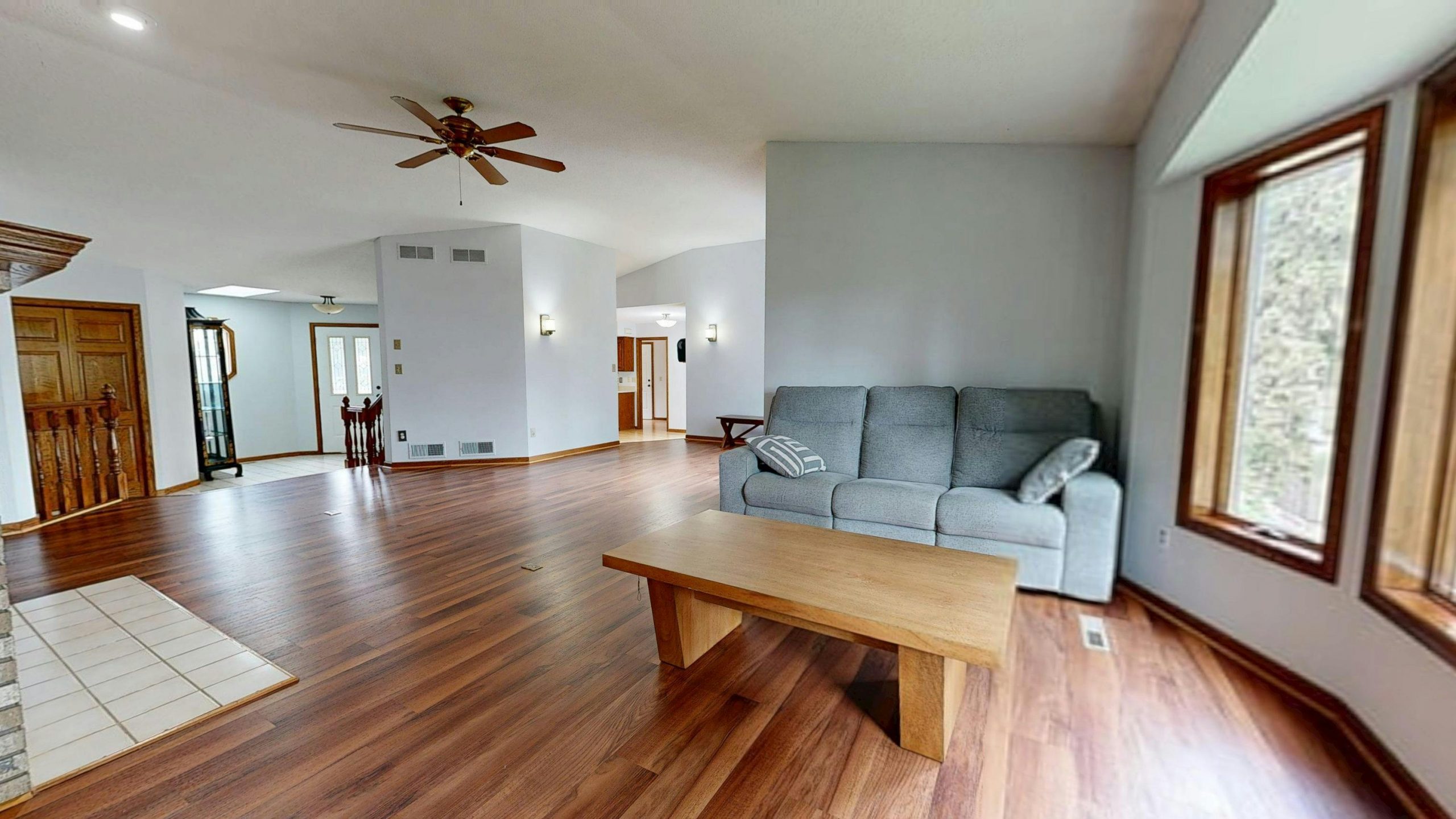 Bright, modern living room featuring hardwood floors and neutral decor.
