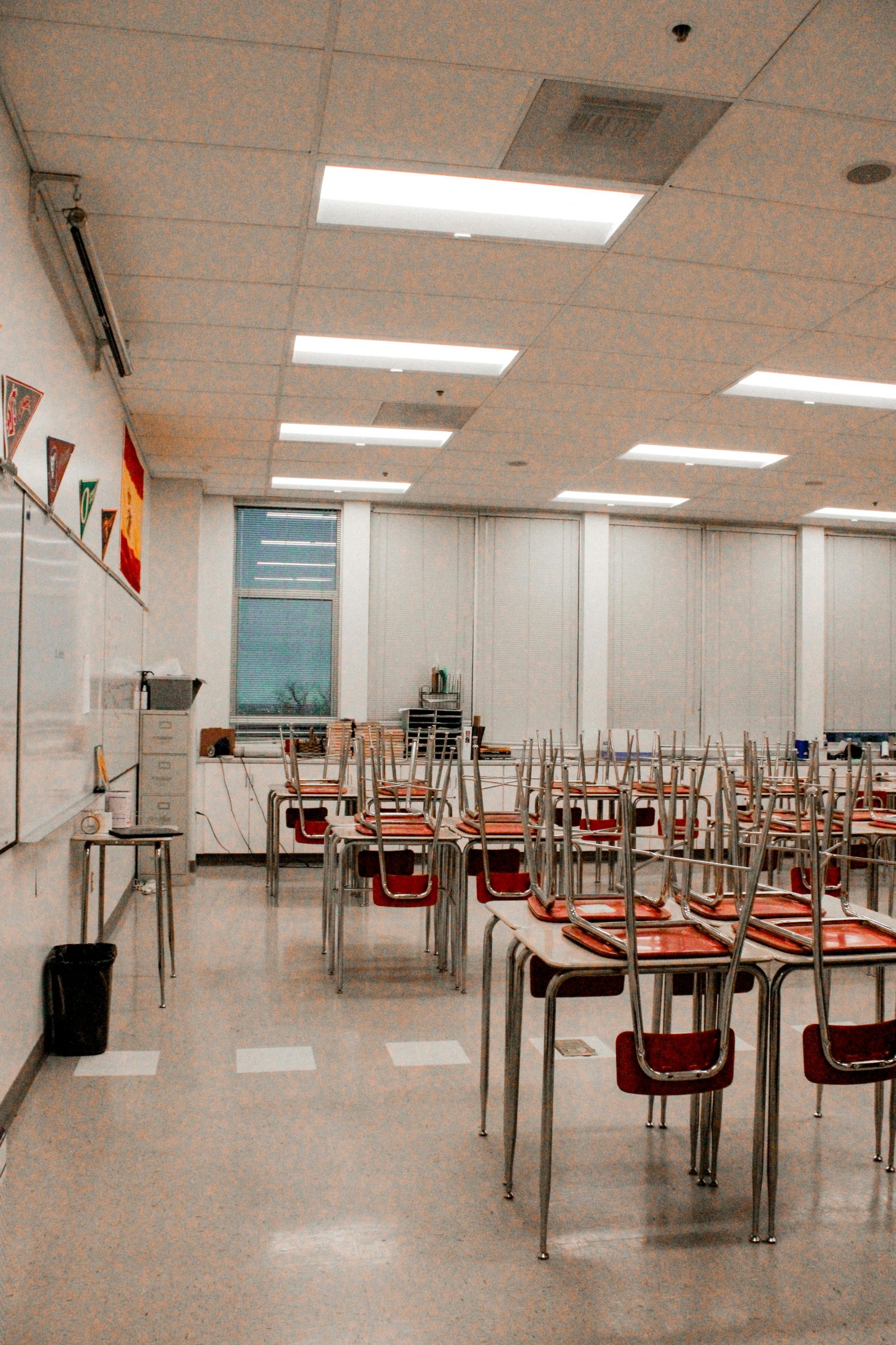Empty classroom interior with desks and stacked chairs, Salt Lake City, Utah.