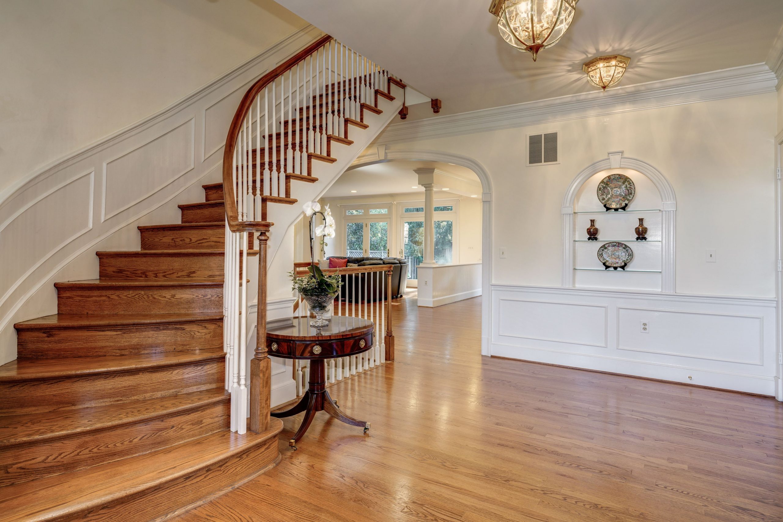 Foyer with curved staircase - Long & Foster Long & Foster Newsroom