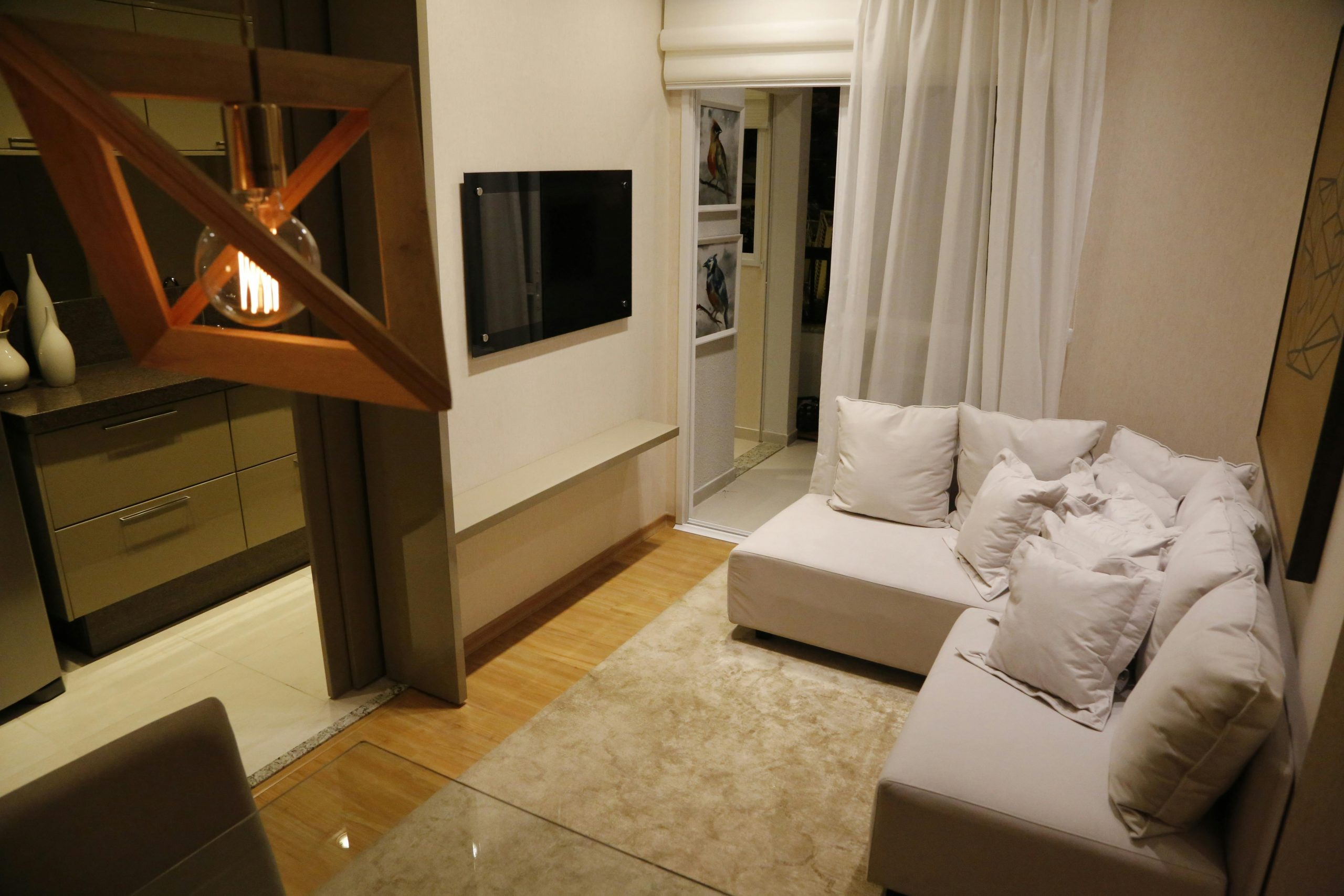 Stylish living room with elegant decor, featuring a cozy couch and modern lighting.