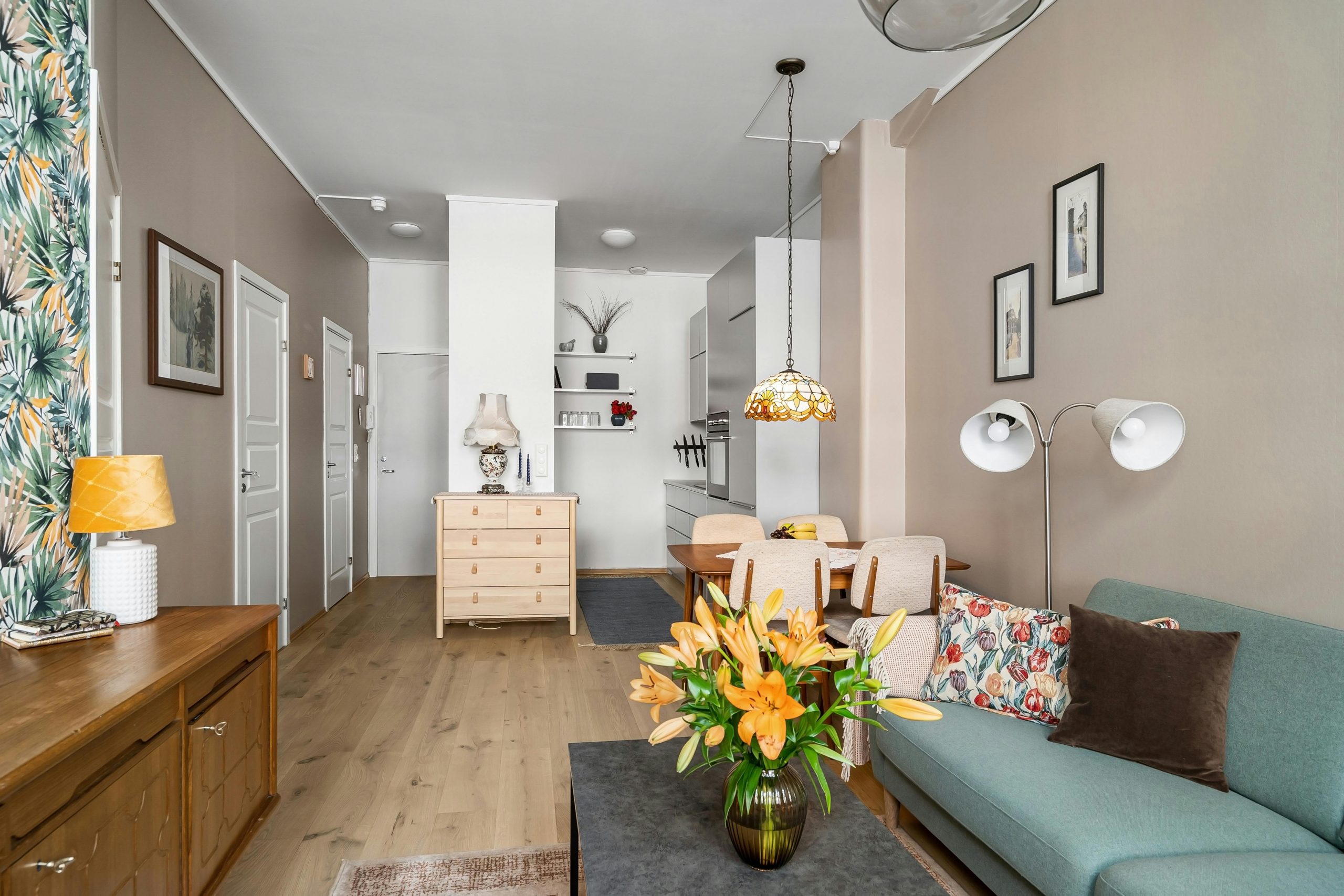 A chic and inviting living room with elegant decor and soft lighting.