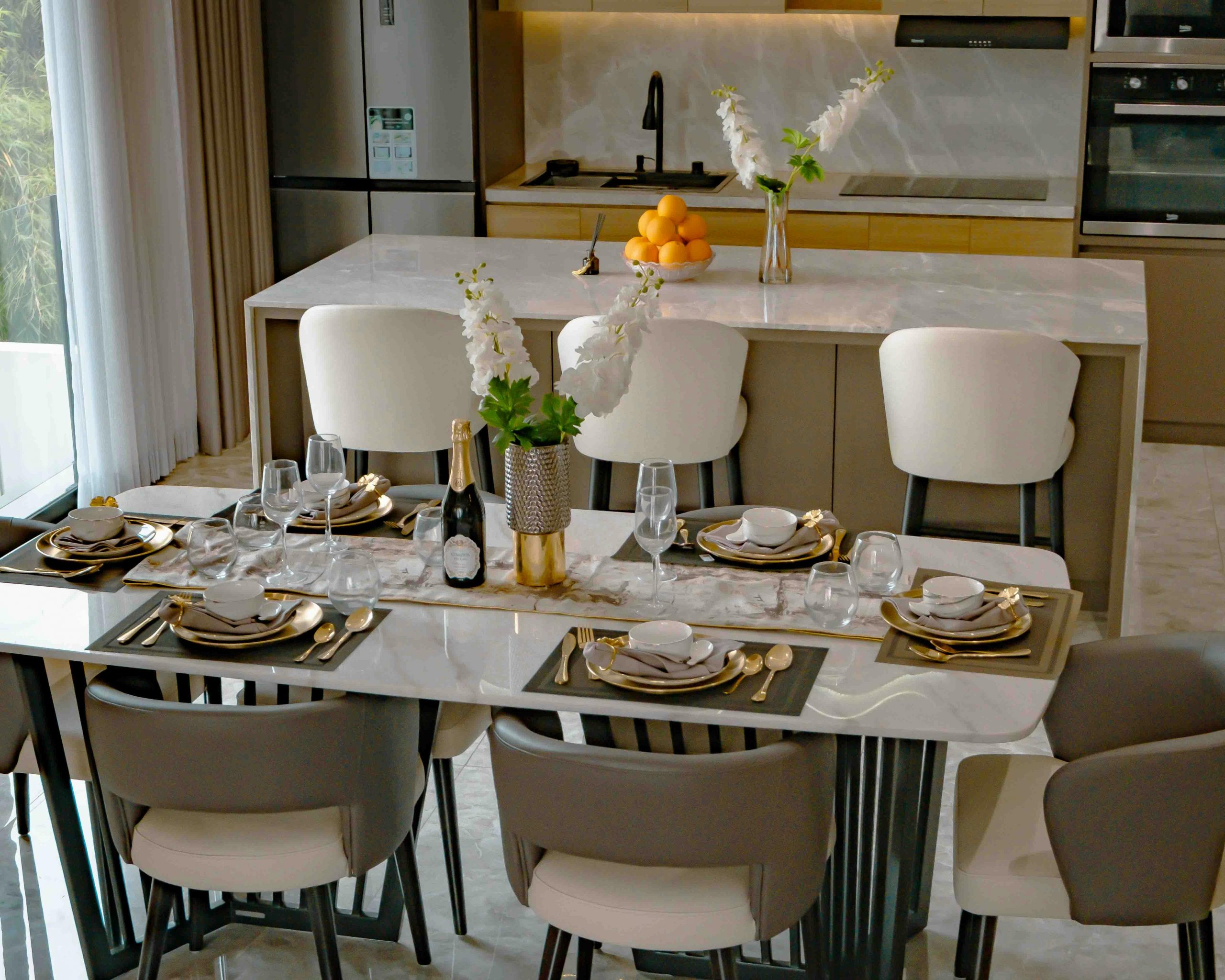 A luxurious dining setup with a modern kitchen backdrop, styled for a formal meal.