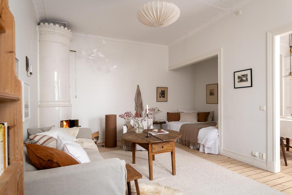 A one-bedroom apartment with a bed nook and a white kitchen - COCO LAPINE DESIGNCOCO LAPINE DESIGN