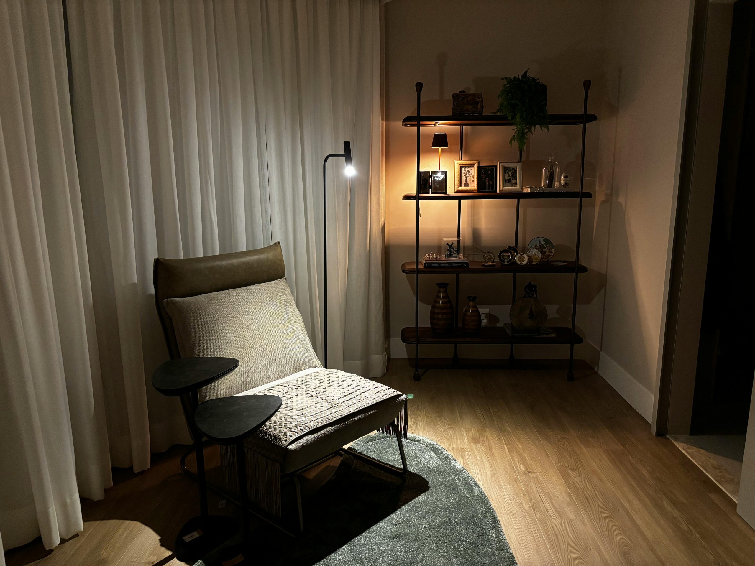 A stylish and cozy lounge area featuring modern furniture and ambient lighting for a serene atmosphere.