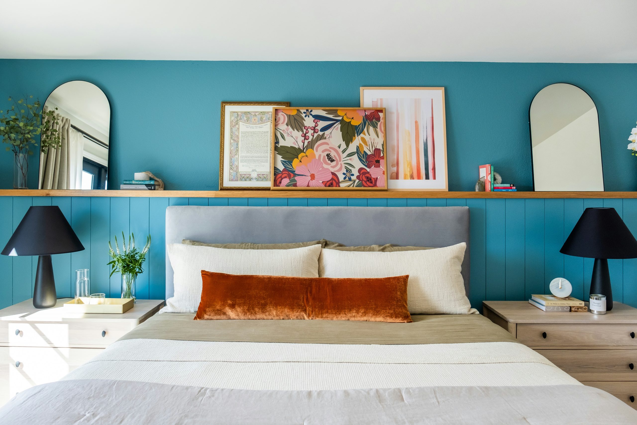 Bedroom bathed in soft sunlight through a large window and two sleek lamps on nightstands provide a gentle ambiance, perfect for relaxation and peaceful sleep!