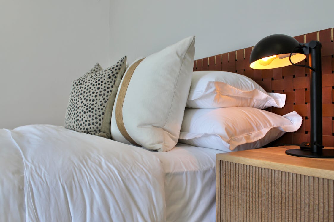 Contemporary Bedroom with Earthy Tones and Minimalist Design · Free Stock Photo