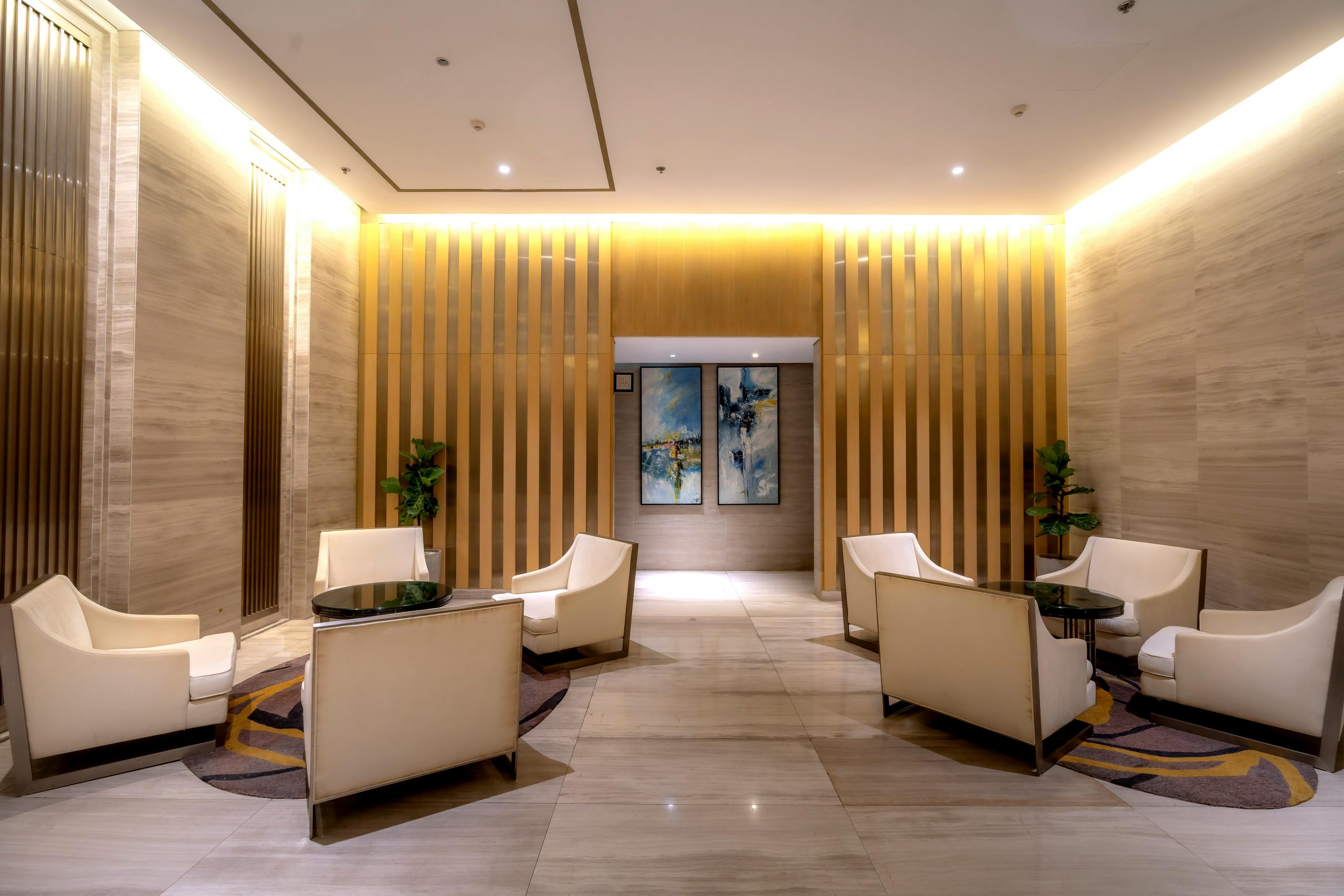 Luxurious hotel lobby featuring contemporary furniture and ambient lighting.