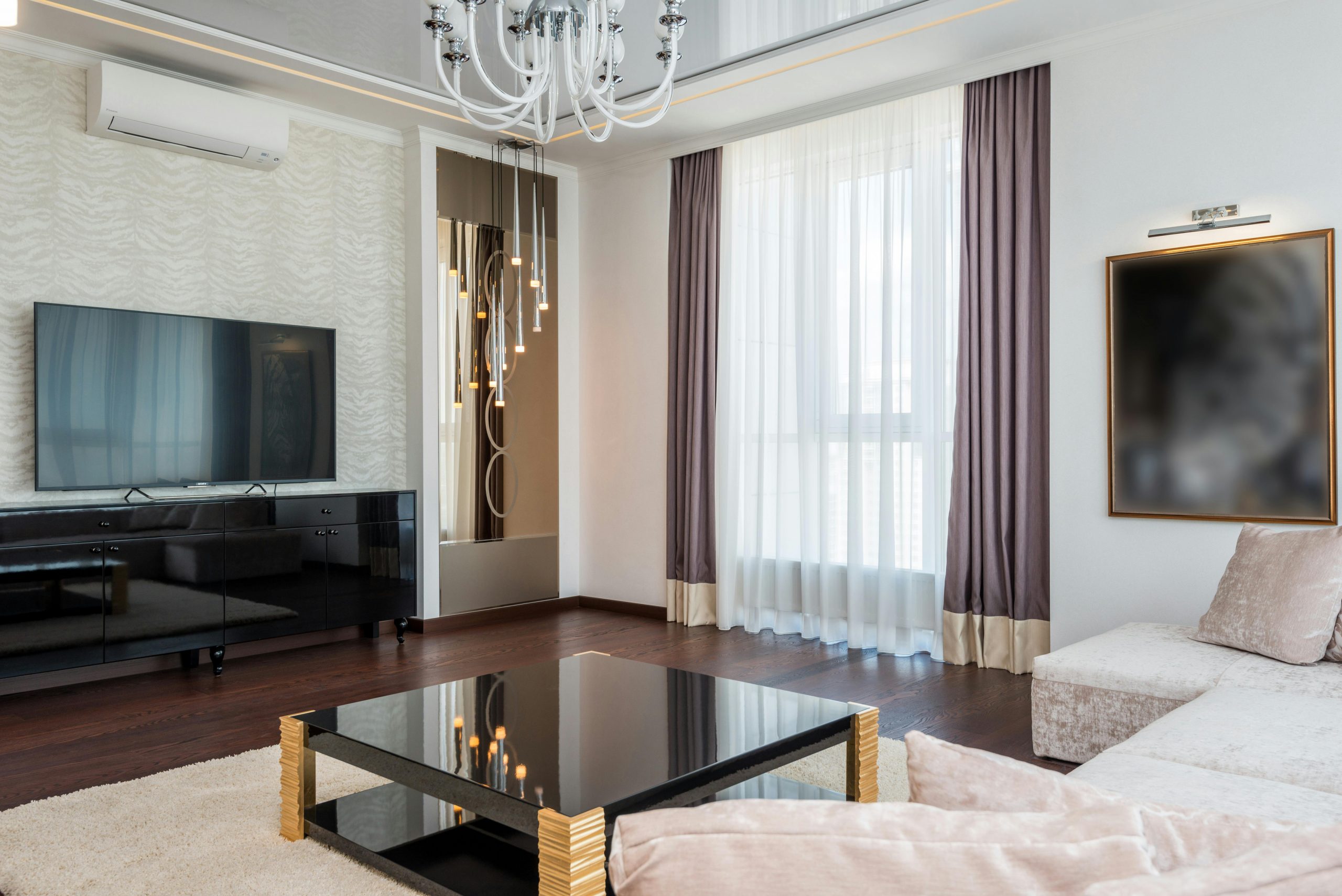 Sleek and stylish modern living room with luxurious furniture and elegant decor.