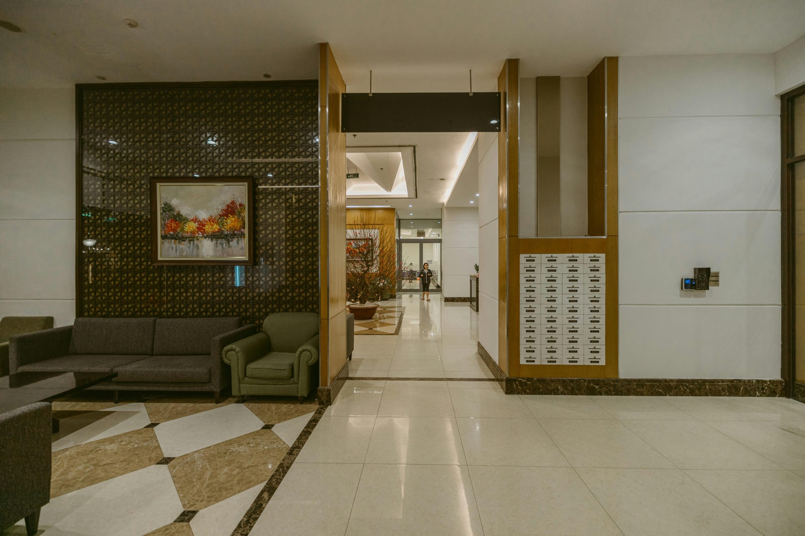 Spacious modern hotel lobby with stylish furniture and artistic decor, inviting ambiance.