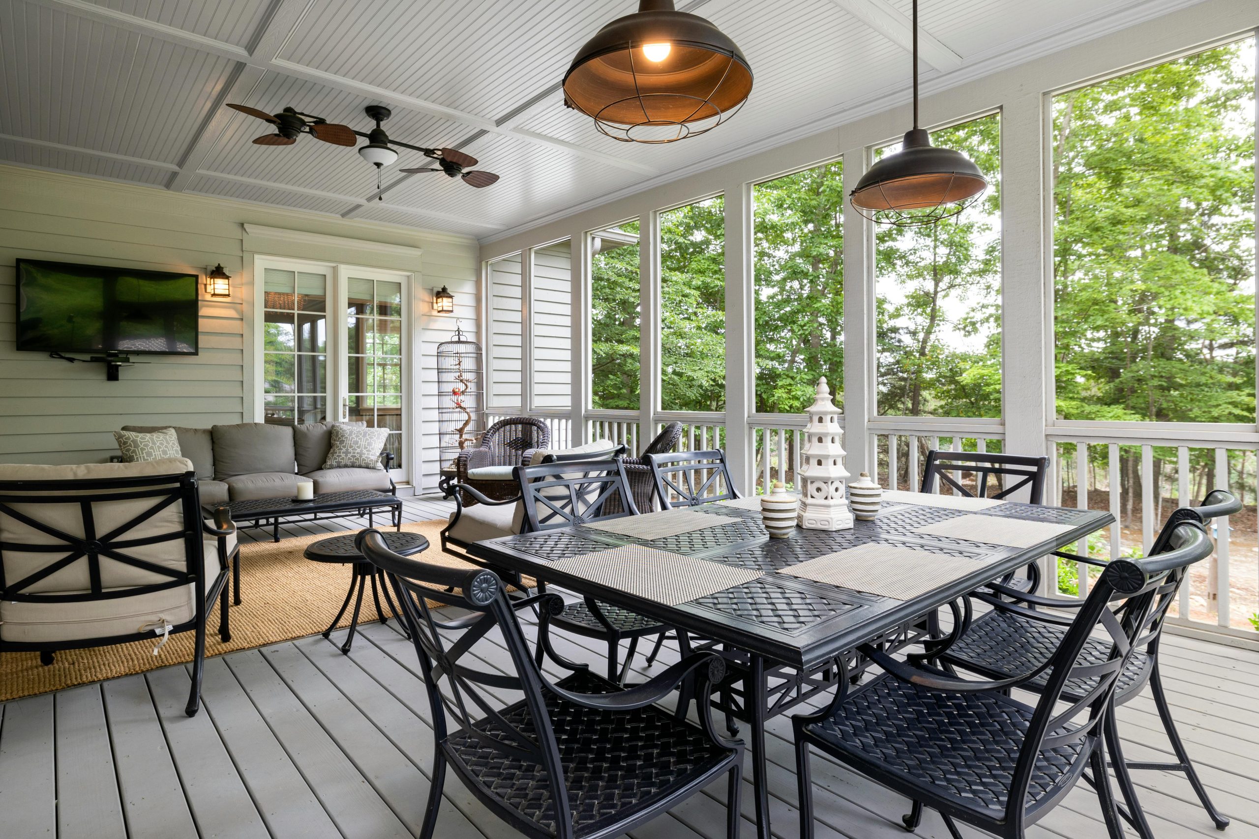 Spacious outdoor patio featuring elegant furniture with a scenic view, perfect for relaxing.