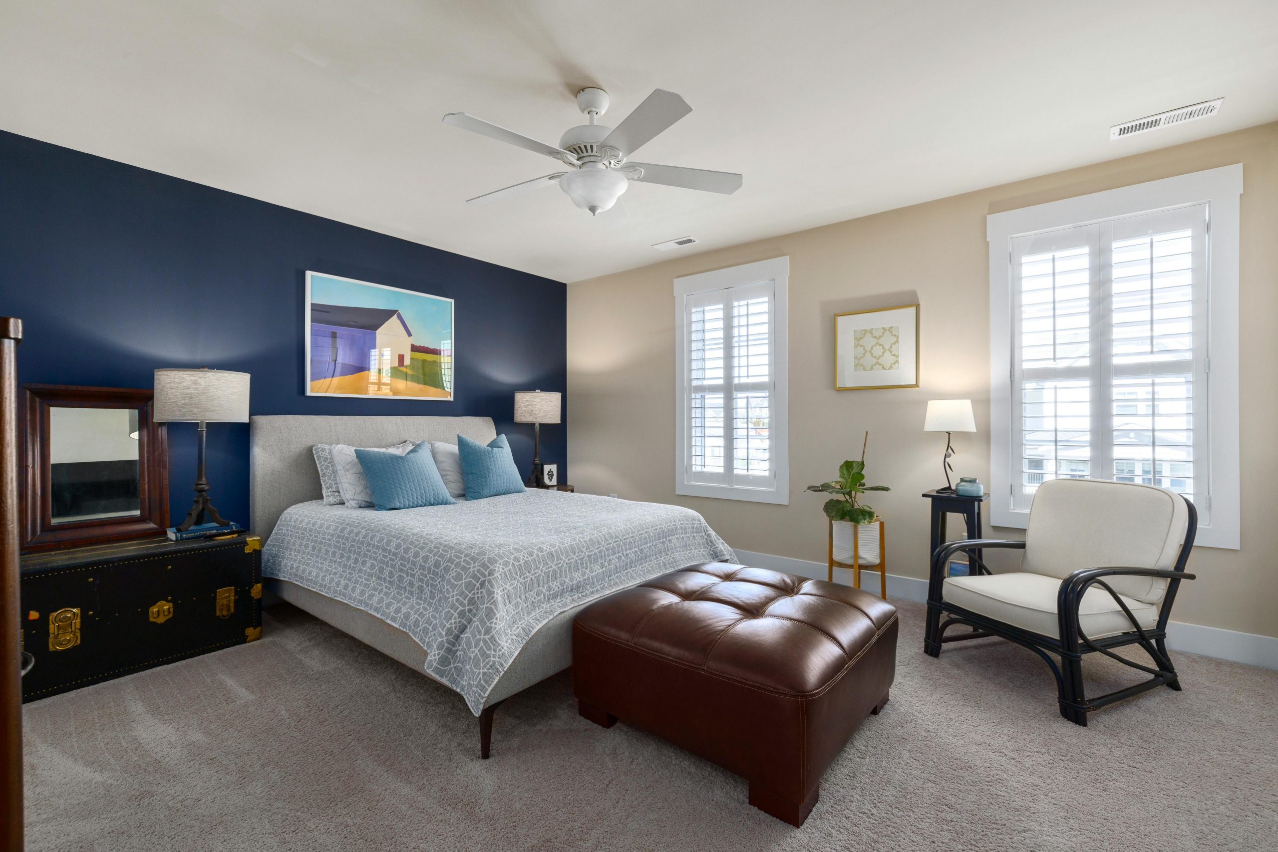 Stylish bedroom featuring a modern bed, minimalist design, and elegant furnishings.