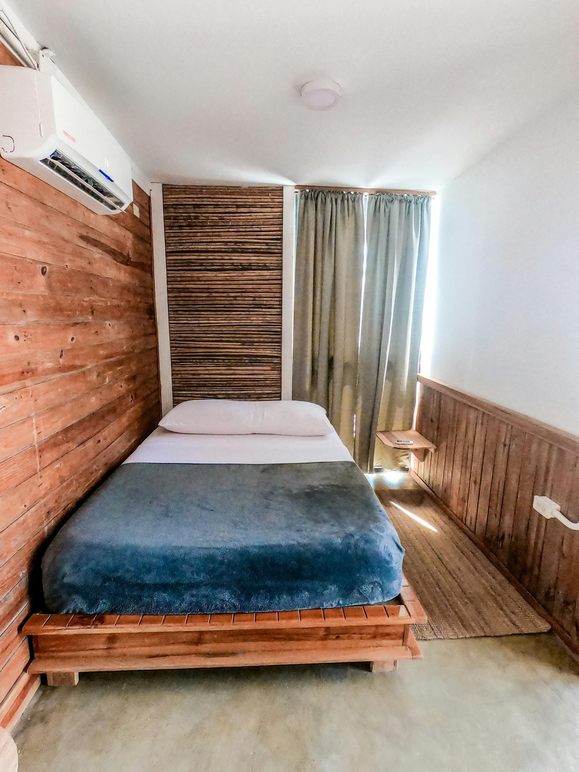 Stylish bedroom interior featuring natural wood textures and contemporary design elements.