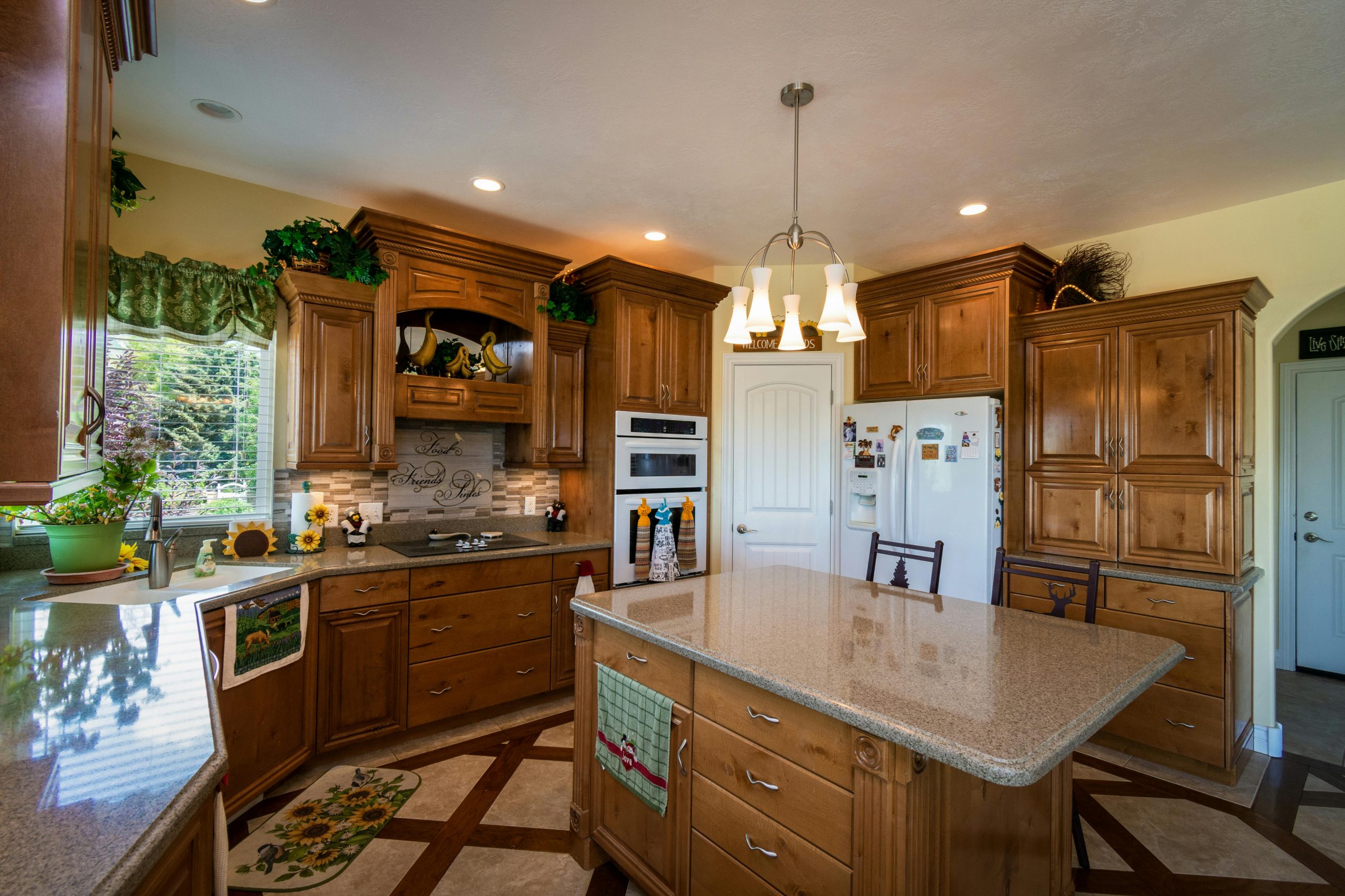 Warm, inviting kitchen interior with wooden cabinets and modern appliances.