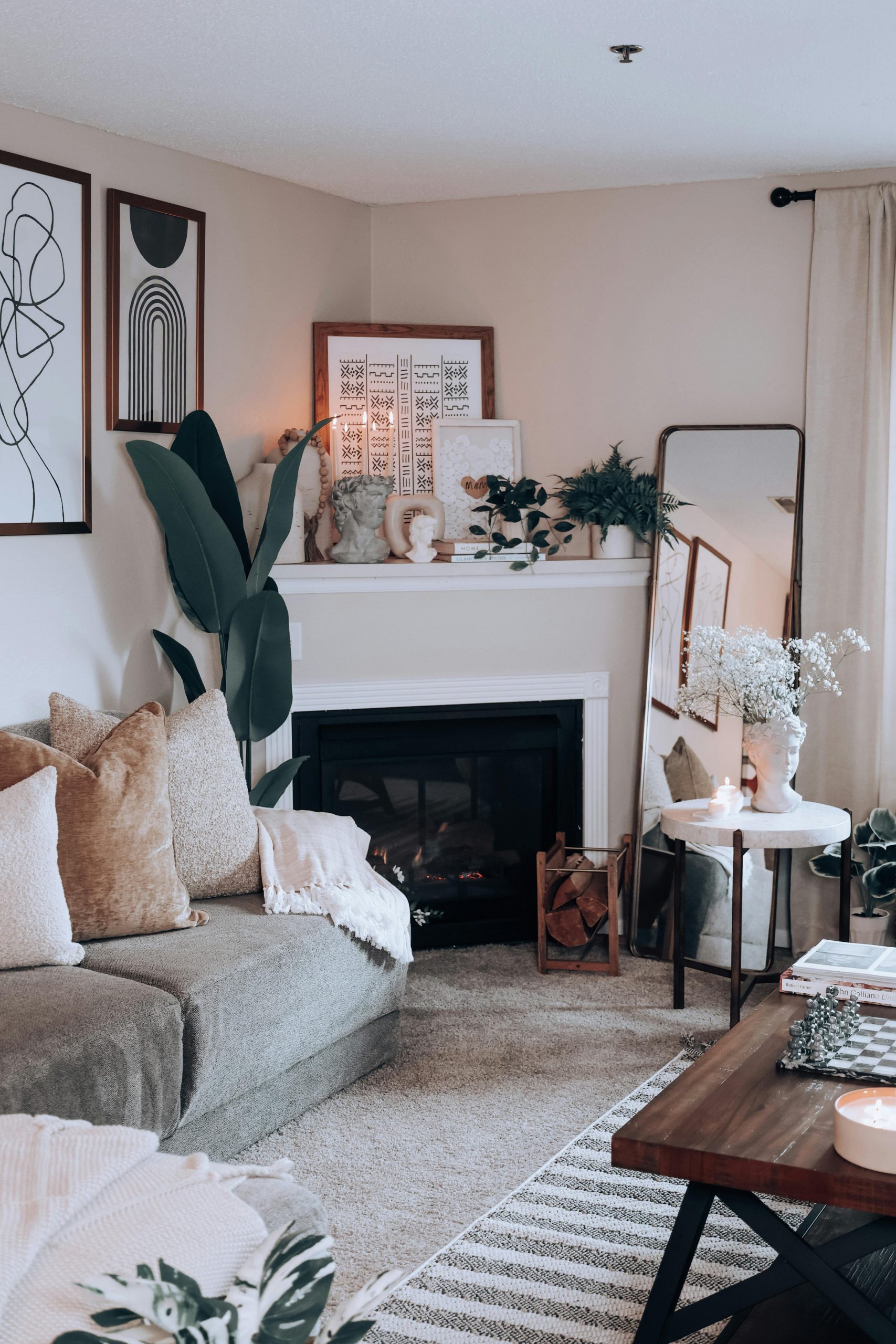 A beautifully designed living room featuring a fireplace, modern decor, and comfortable seating in a cozy setting.