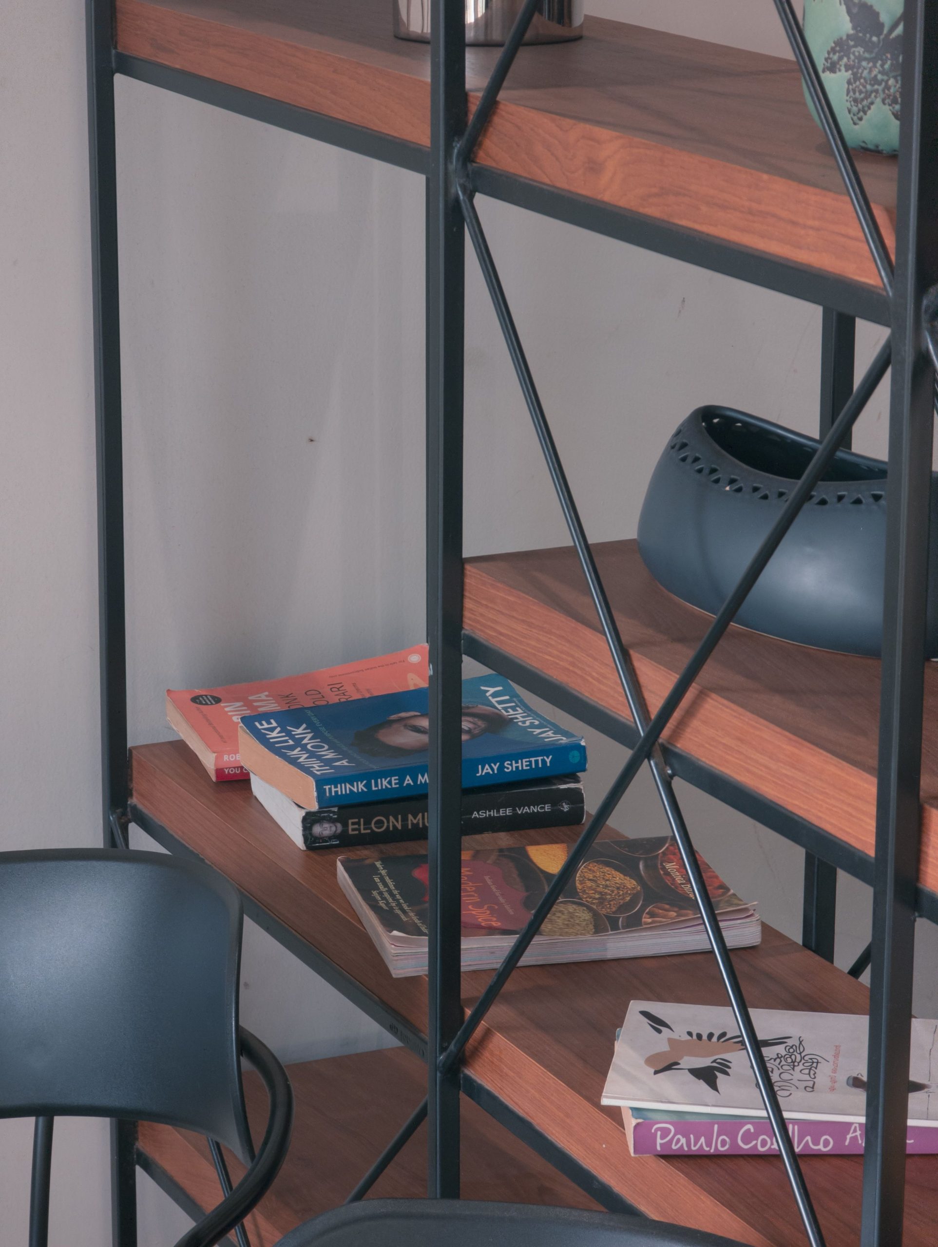 A stylish bookshelf with a mix of books and modern decor items, perfect for a contemporary interior.