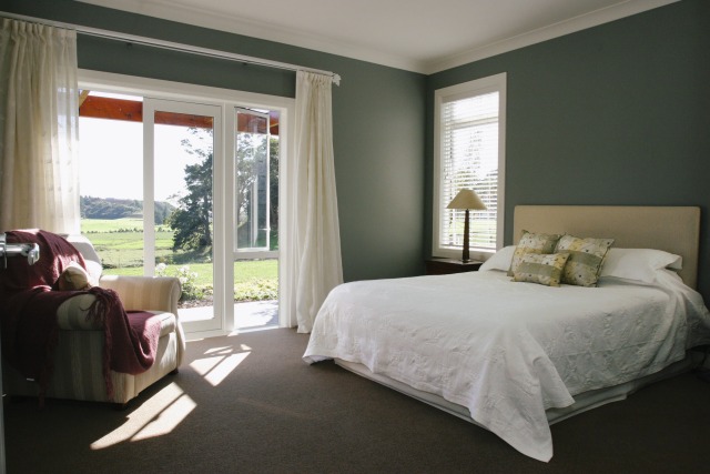 A view of a bedroom, dark green wal... - Gallery - 2 | Trends
