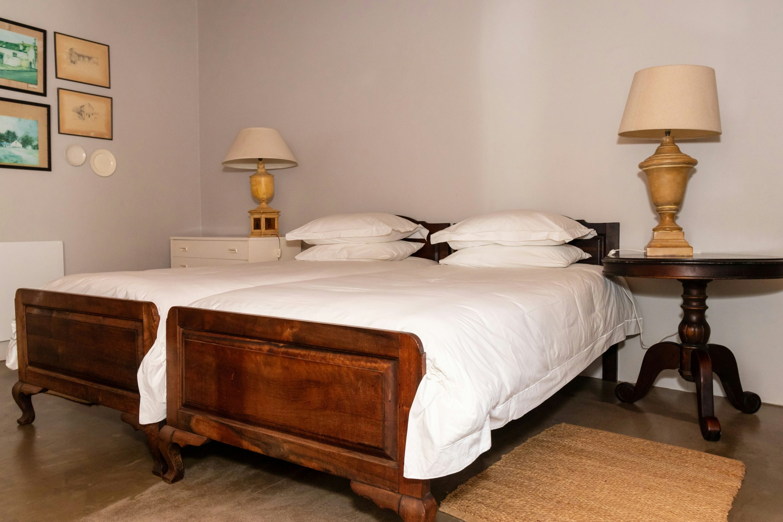 Bedroom in a farm cottage with a bedside lamps on a bedside tables