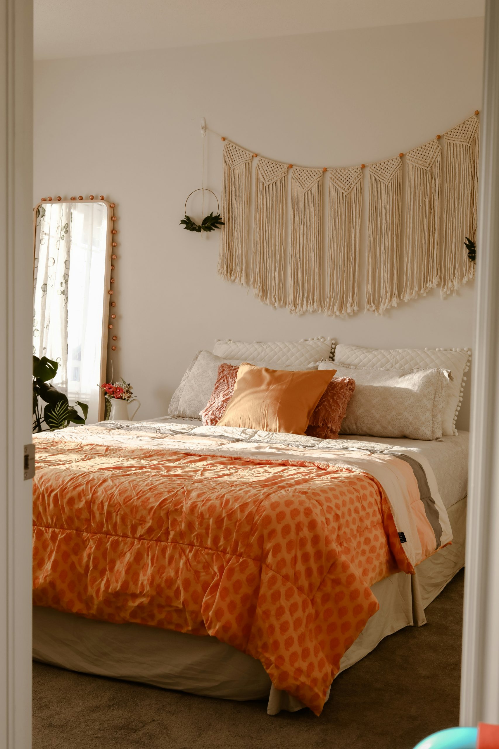 Boho bedroom with sunlight and yellow duvet