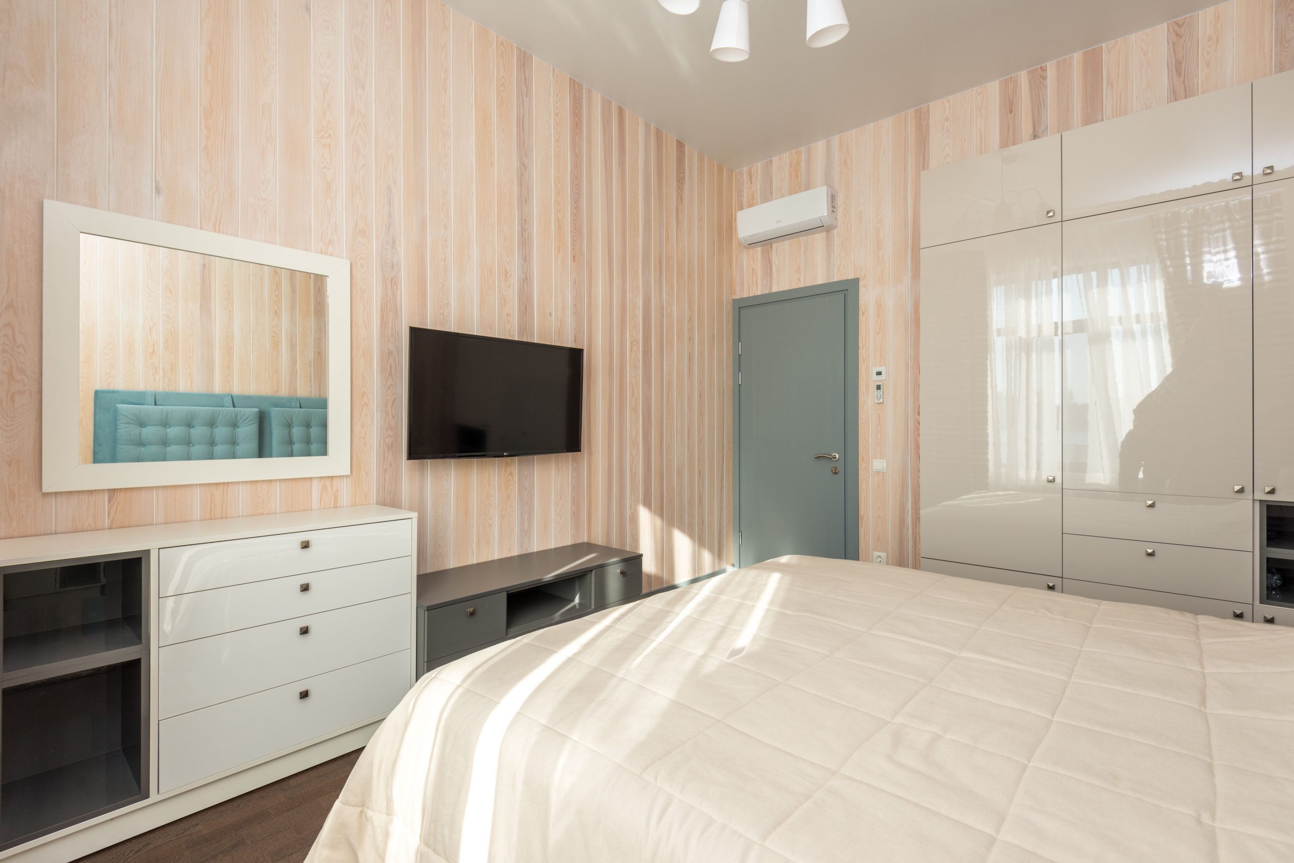 Bright and airy master bedroom featuring minimalist design with contemporary furniture.