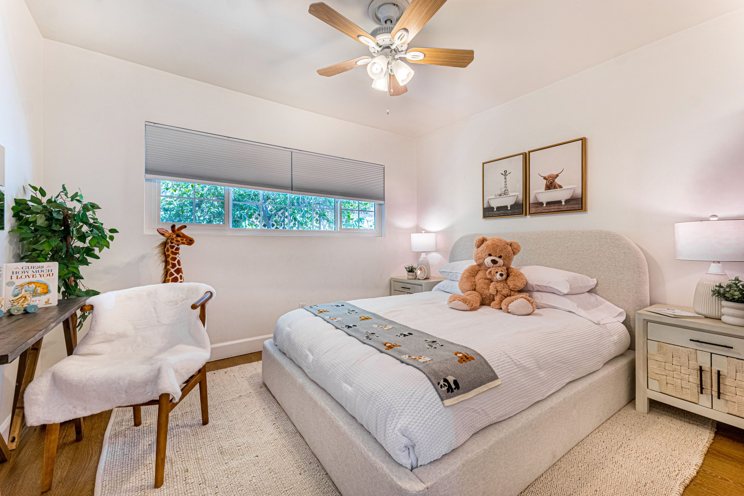 Bright and cozy children's bedroom with plush teddy bear and modern design elements.