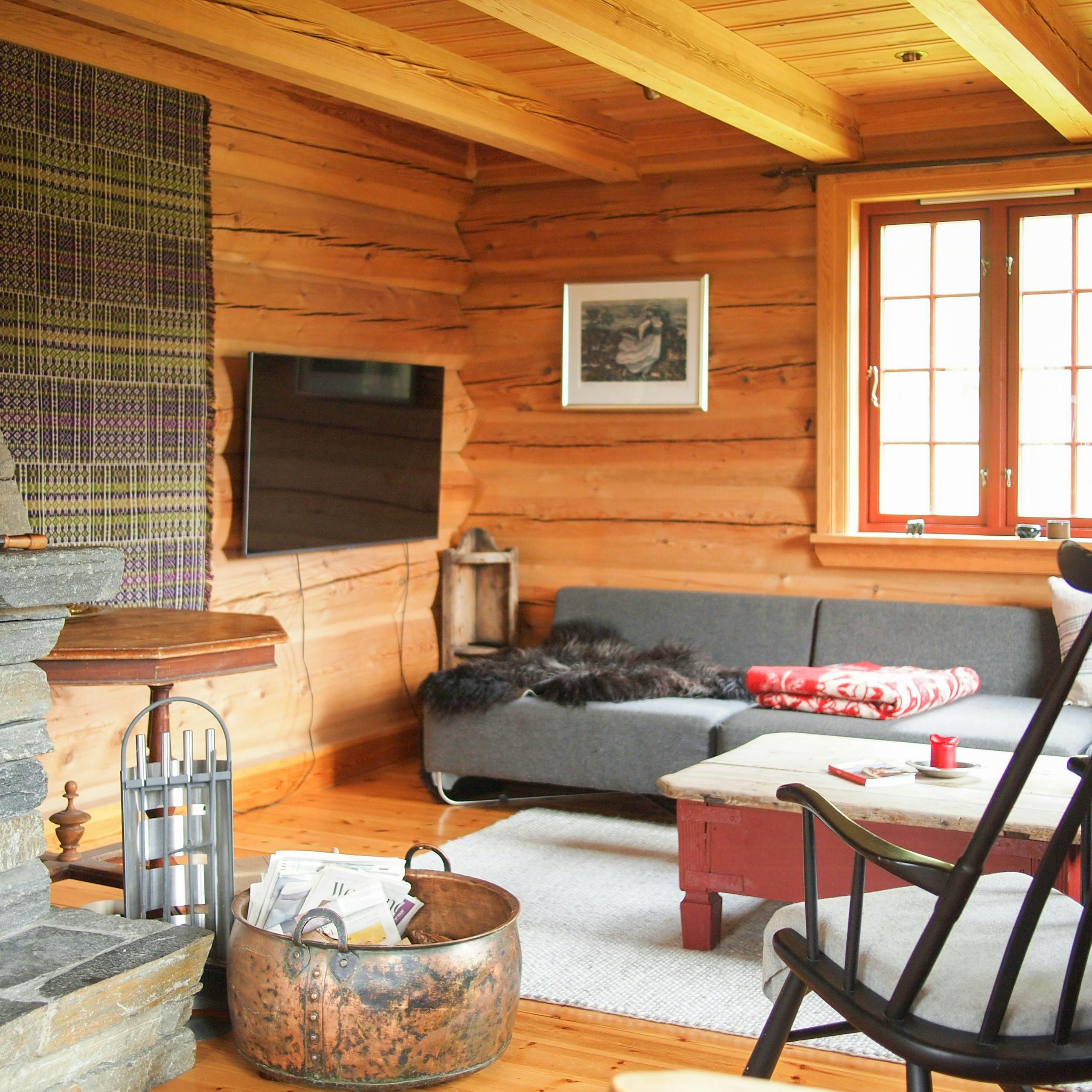 Cabin with wooden interior by Lake Tinnsjøen