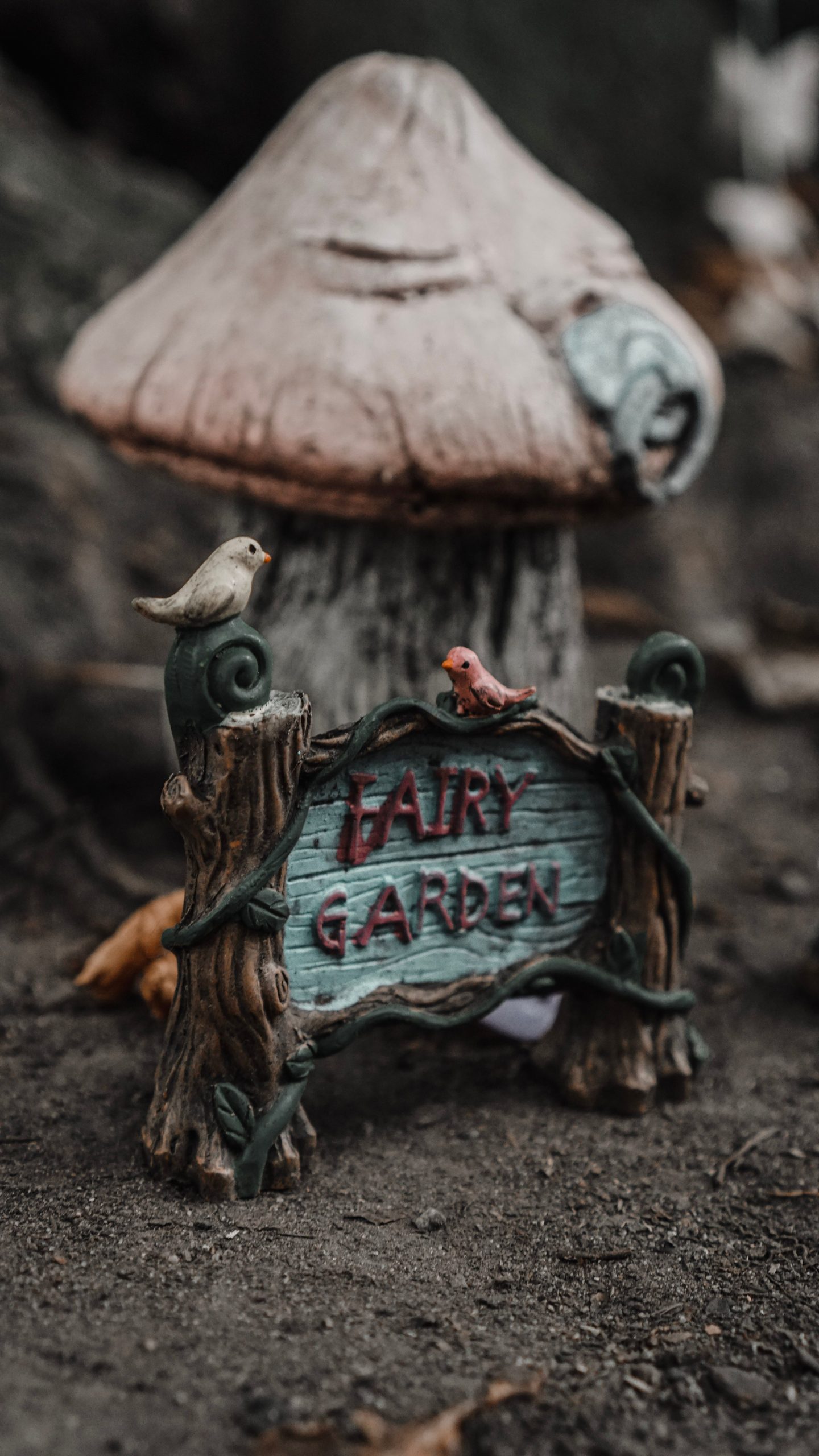 Captivating fairy garden setup with a whimsical mushroom house, perfect for fantasy lovers.
