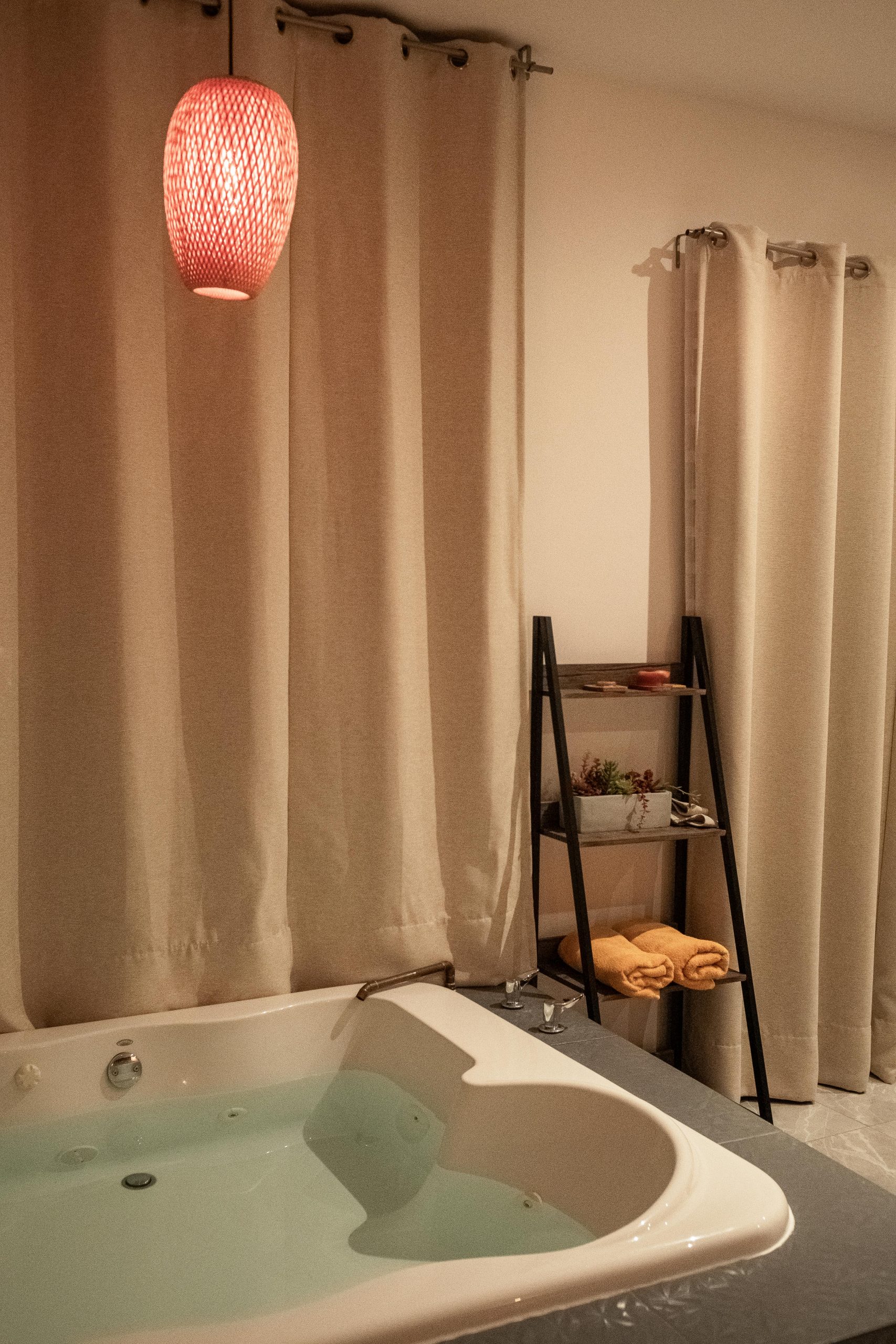 Contemporary bathroom setting featuring a luxurious bathtub and stylish decor.