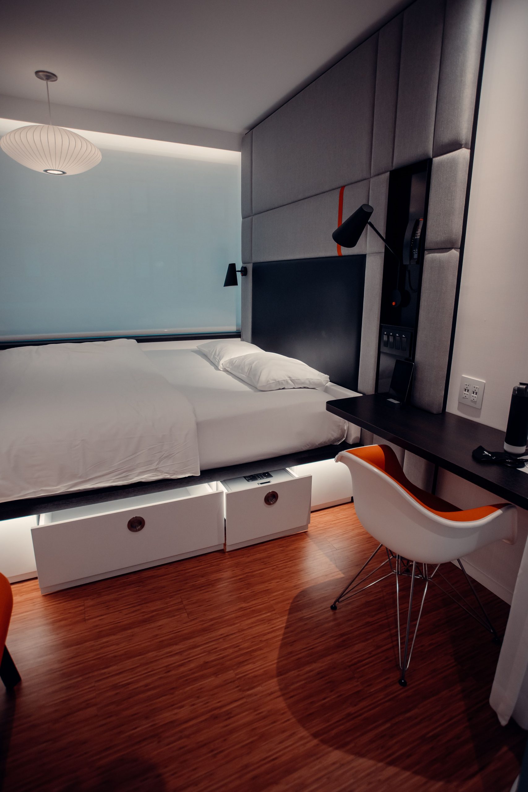 Discover a cozy and chic modern bedroom with elegant design and warm tones.