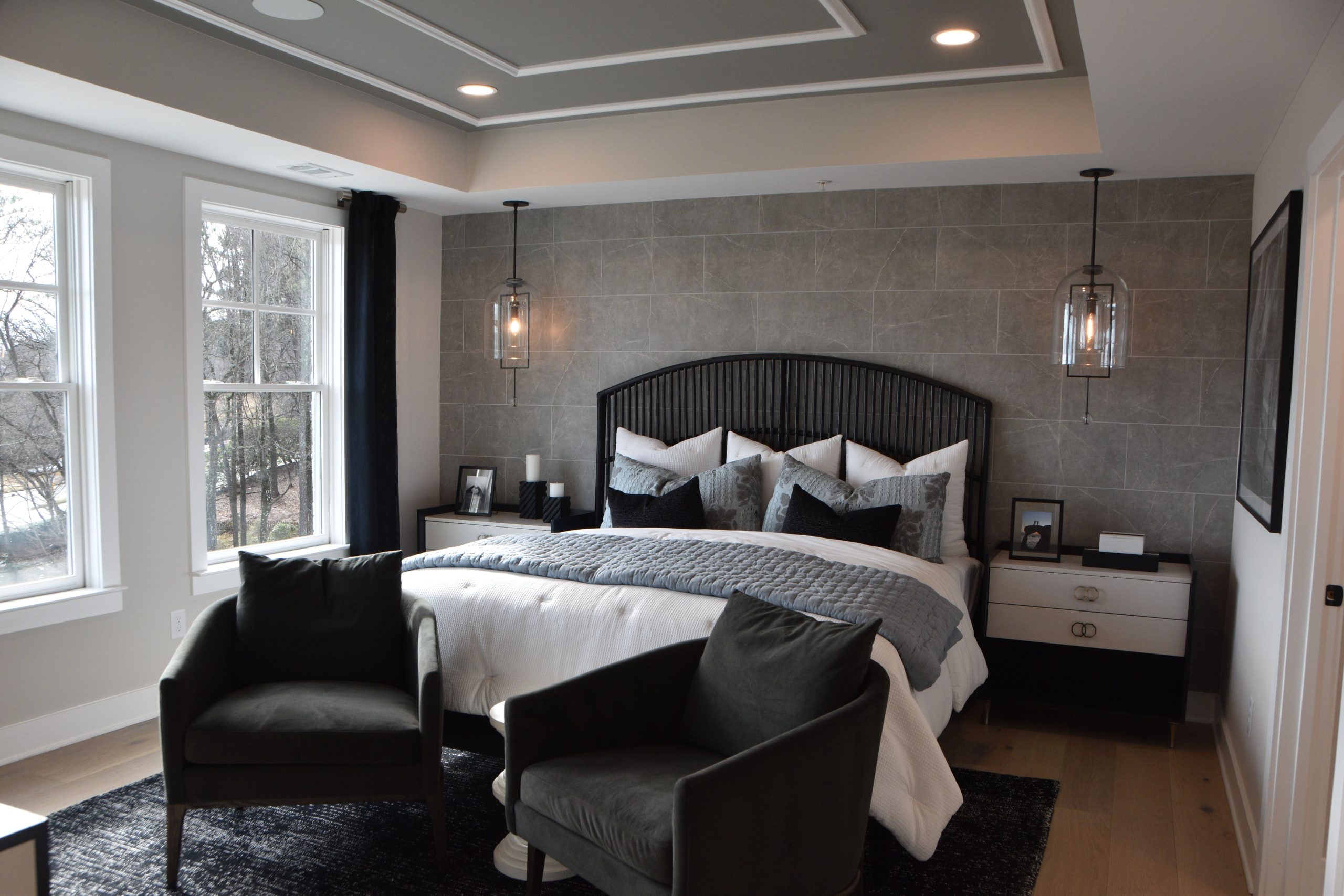 Elegant modern bedroom featuring stylish decor, cozy furniture, and soft lighting creating a warm ambiance.