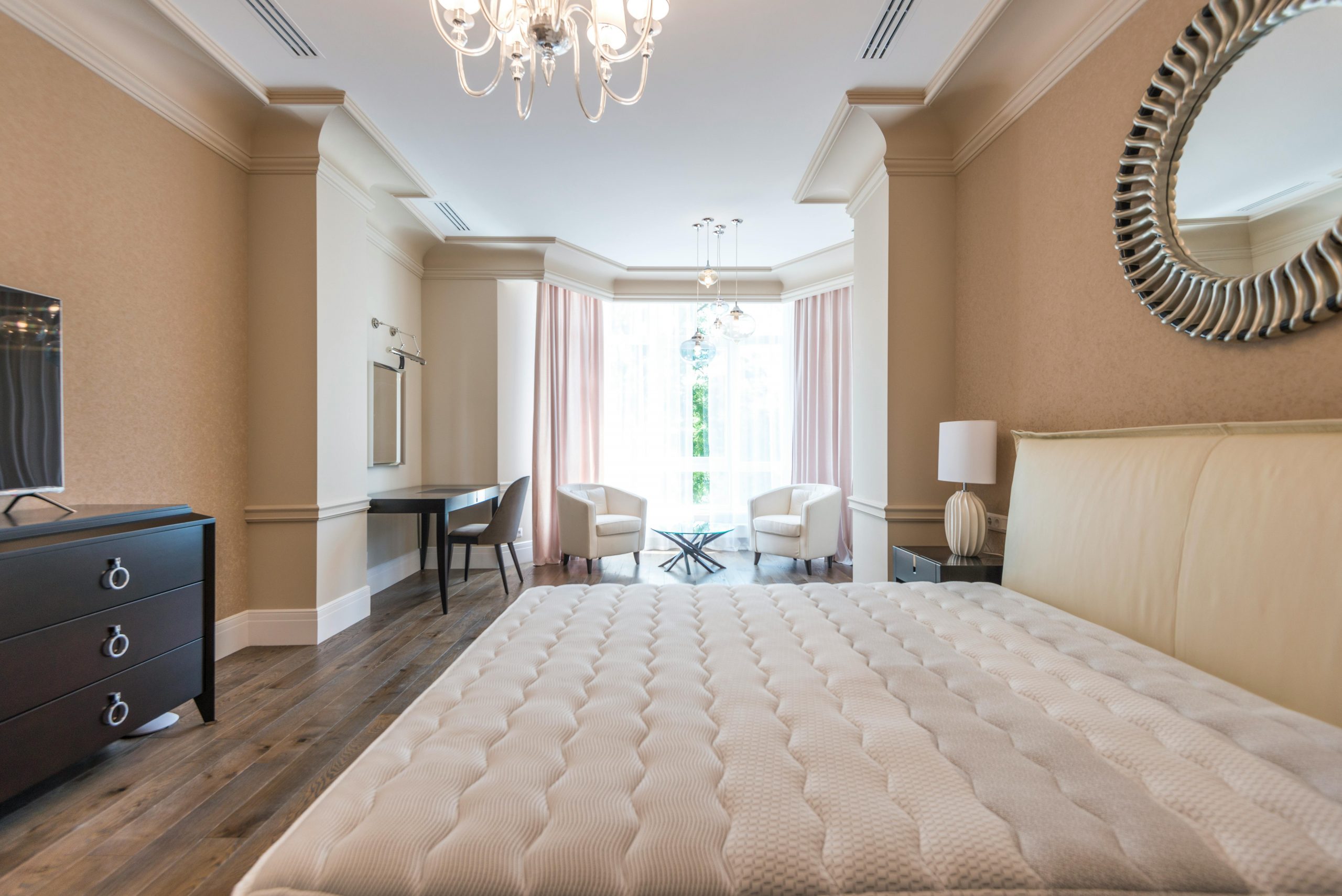 Luxurious modern bedroom with elegant furnishings and natural light