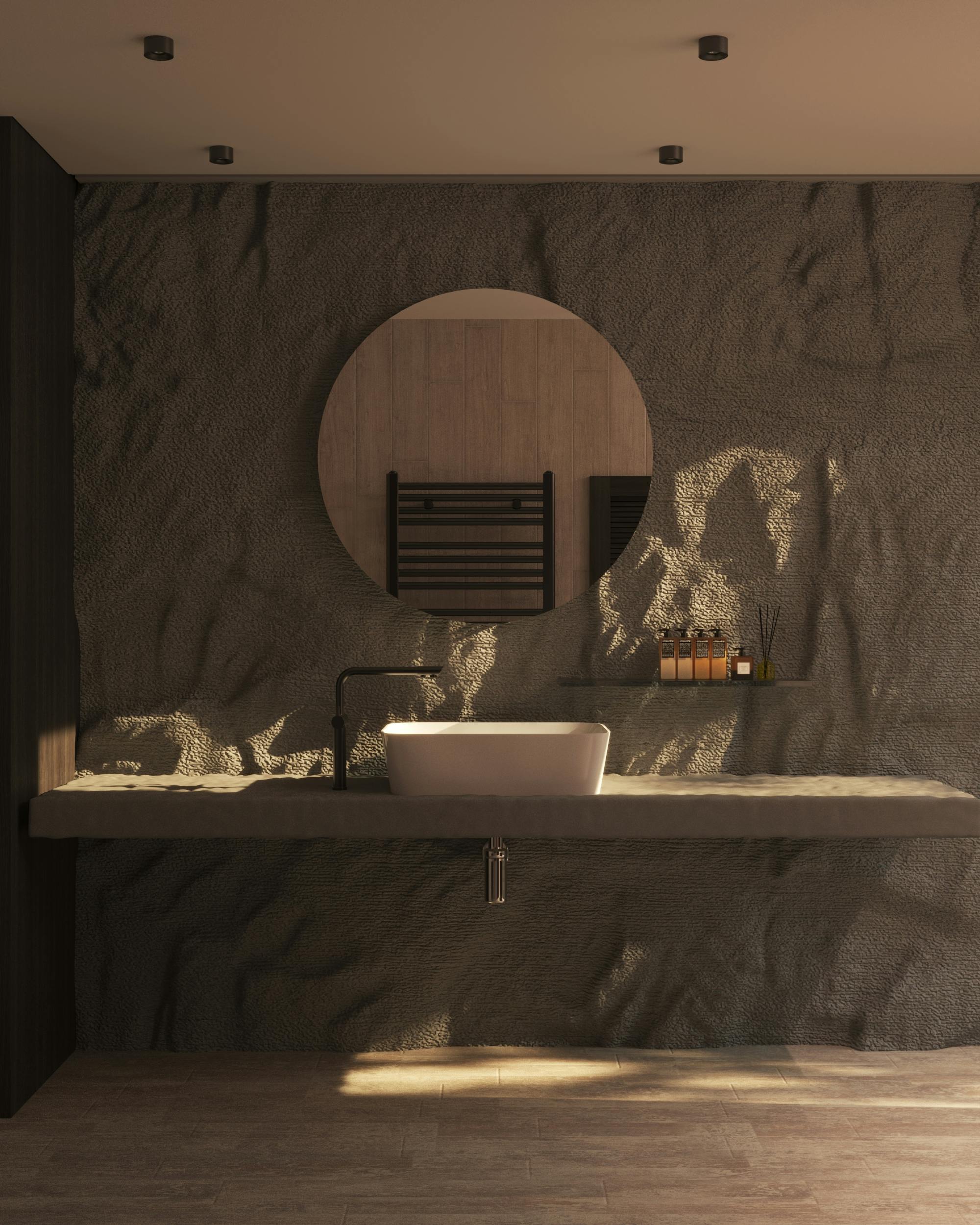 Minimalist luxury bathroom featuring designer sink, round mirror, and textured wall.