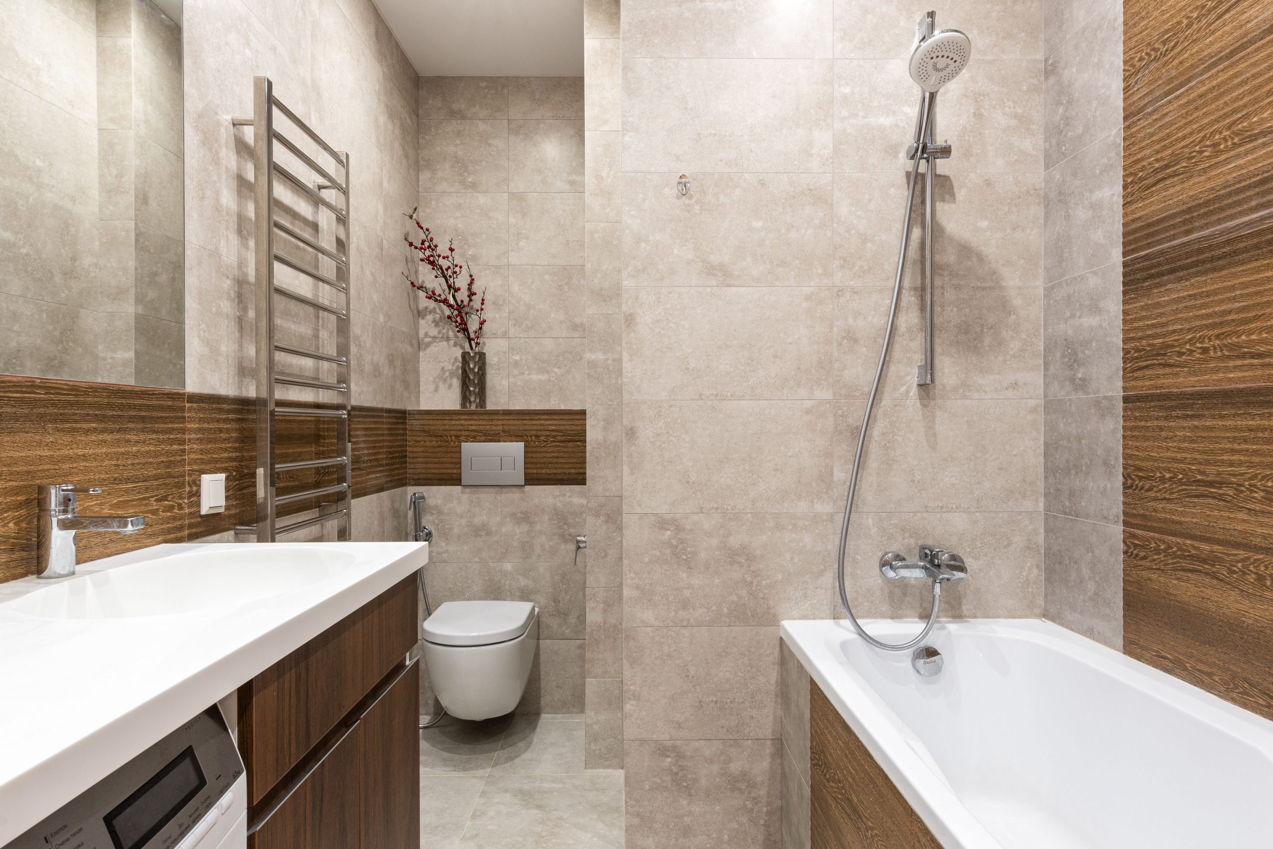 Sleek bathroom design featuring a bathtub, shower, and modern fixtures.