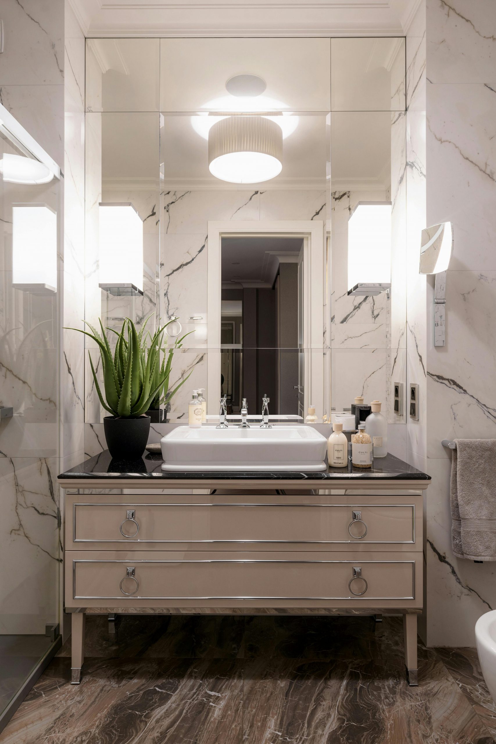 Sophisticated bathroom interior featuring marble, minimalist design, and elegant fixtures.