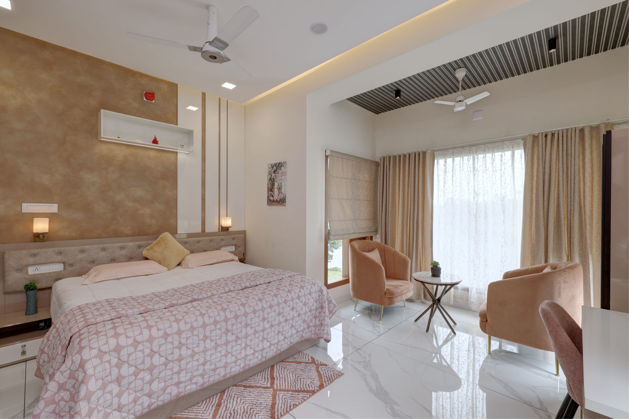 Spacious and elegant bedroom with modern design and decor in Aluva, Kerala.