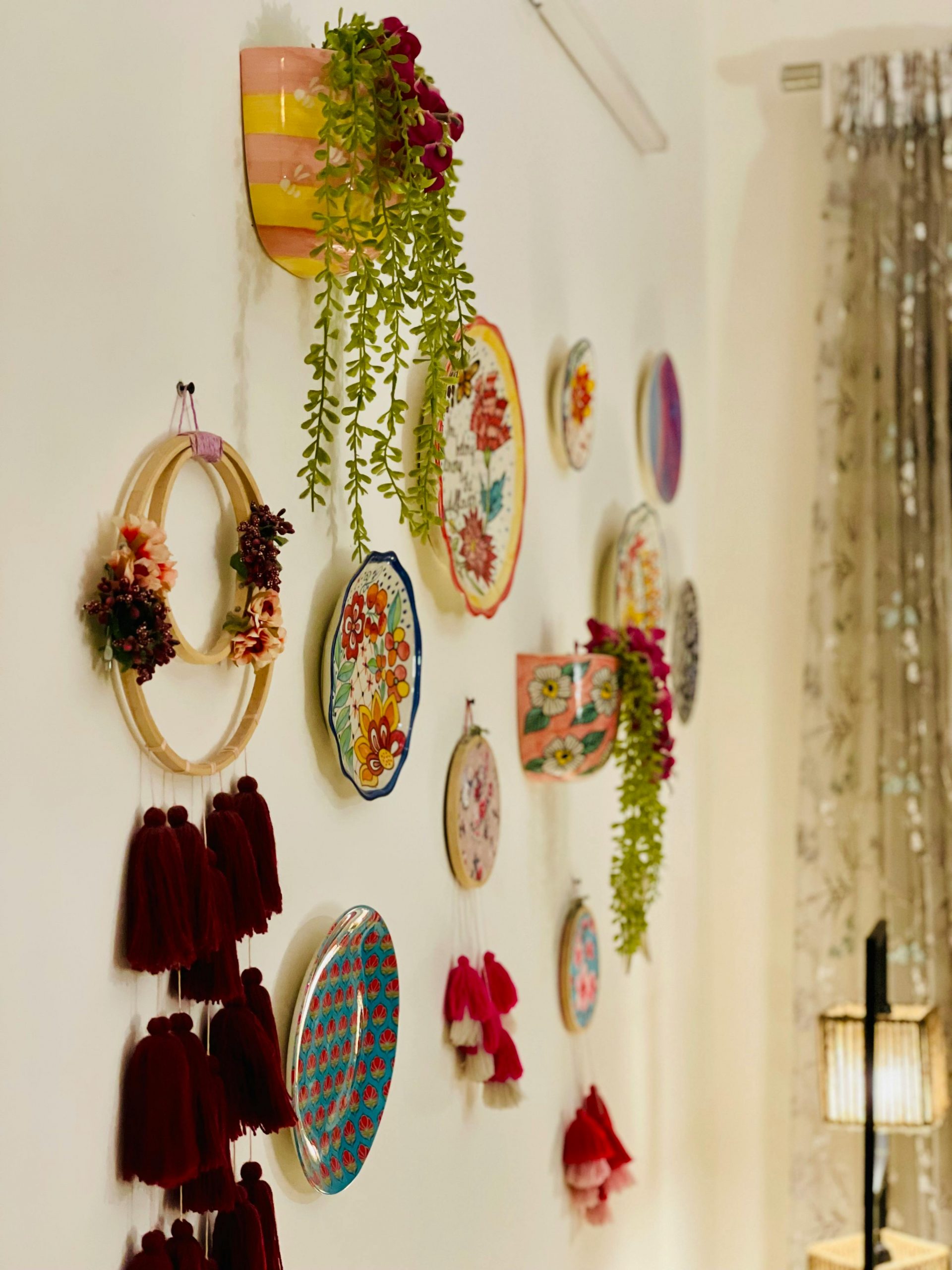 Vibrant handcrafted wall art and decorations creating a cozy and artistic ambiance indoors.
